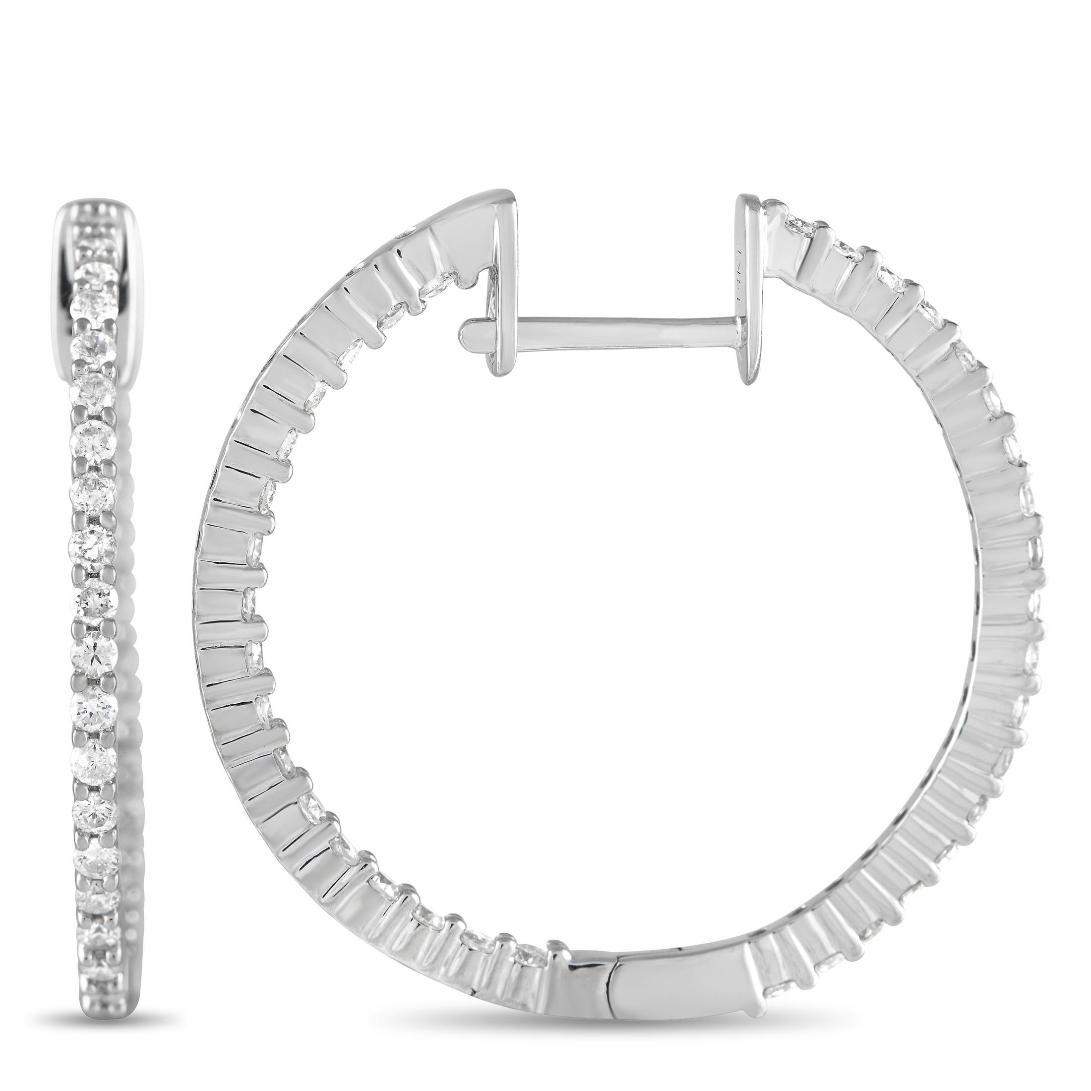These subtle and sleek hoops can easily transition from work to date nights. They're exquisitely crafted in cool white gold with brilliant diamonds tracing their outer front edge and inner back edge. Each hoop measures 1