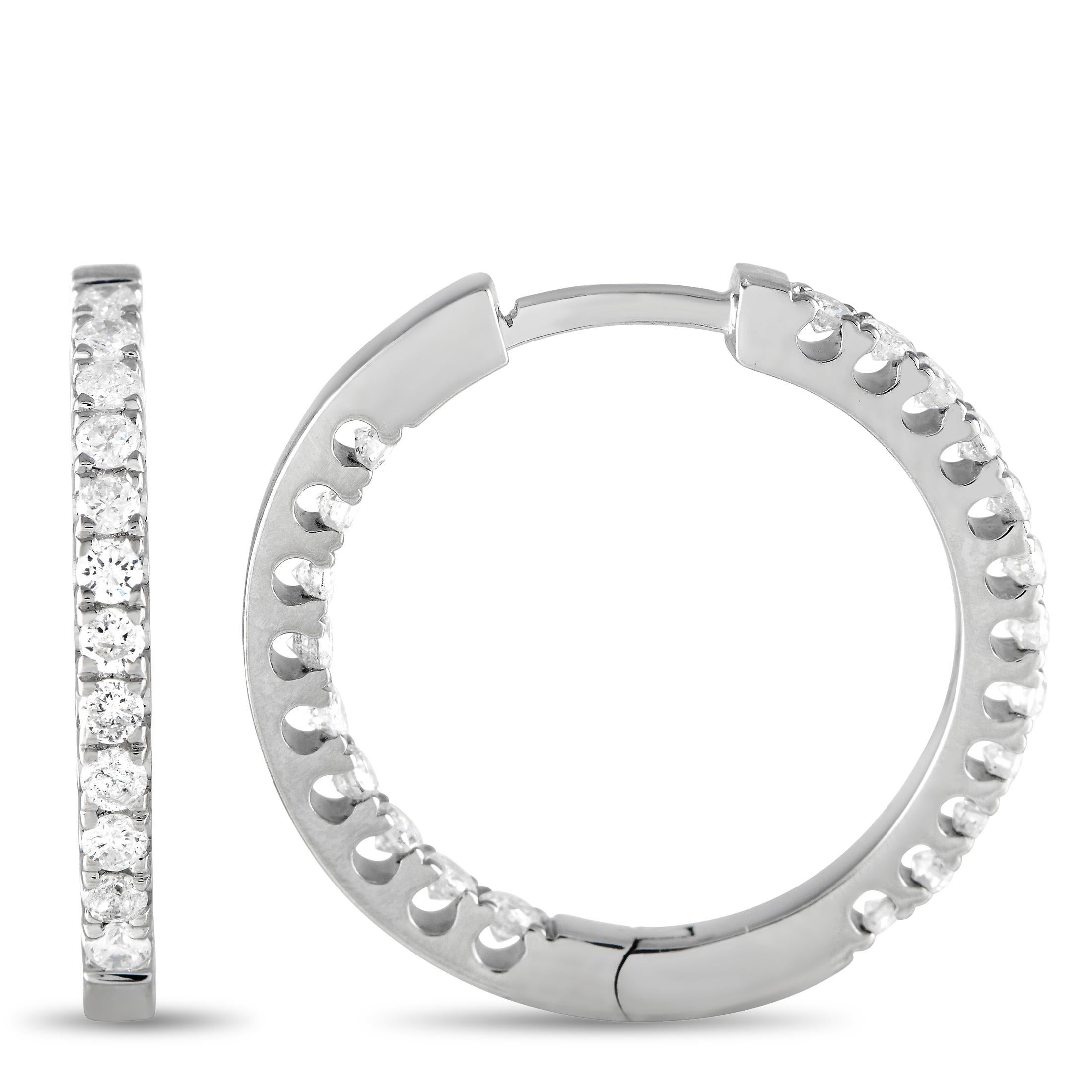 Add sparkle to any ensemble with these impeccably crafted 14K white gold inside-out hoop earrings. A shimmering 14K white gold setting perfectly showcases the round-cut diamonds, which together possess a total weight of 1.0 carats. Each one of these