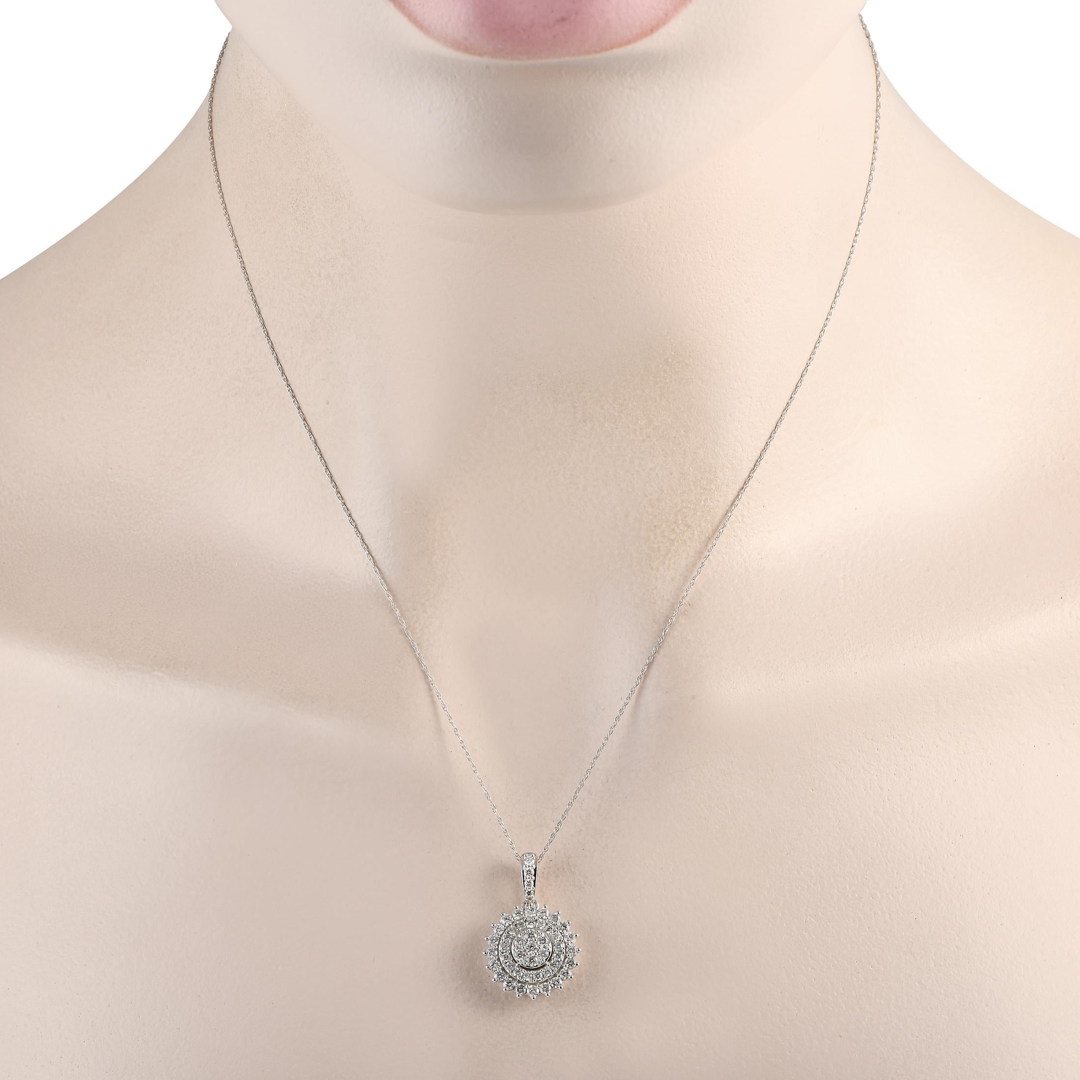 A sunburst pendant measuring 1.0 long by 0.65 wide makes a statement on this impressive necklace. Suspended from an 18 chain, the 14K White Gold pendant shines to life thanks to Diamonds totaling 1.0 carats.This jewelry piece is offered in brand new