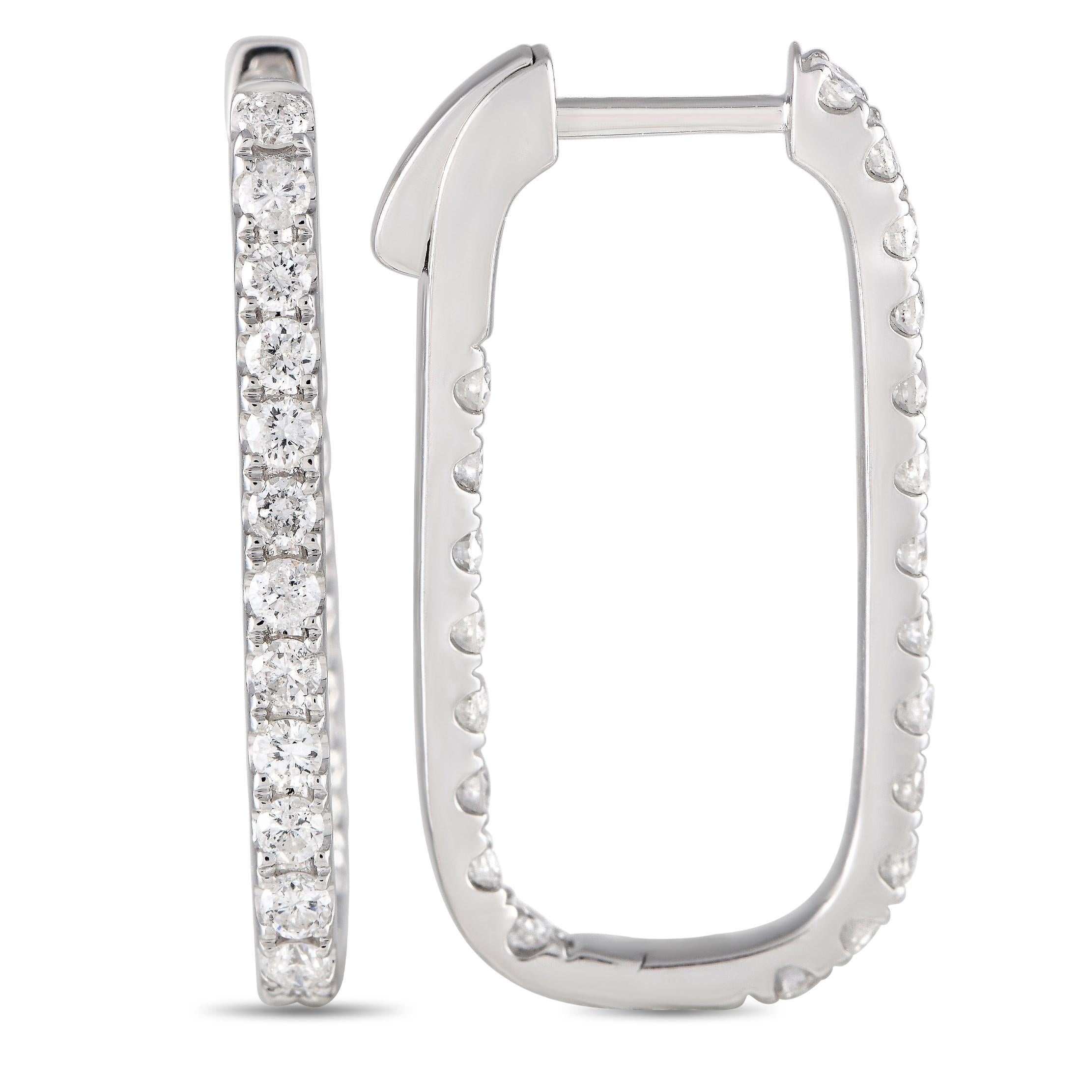 These impressive earrings offer a fresh, elevated take on a classic hoop. The 14K White Gold setting measures 1.0 long by 0.50 wide and features a rectangular shape with curved edges. Diamonds with a total weight of 1.10 carats allow them to