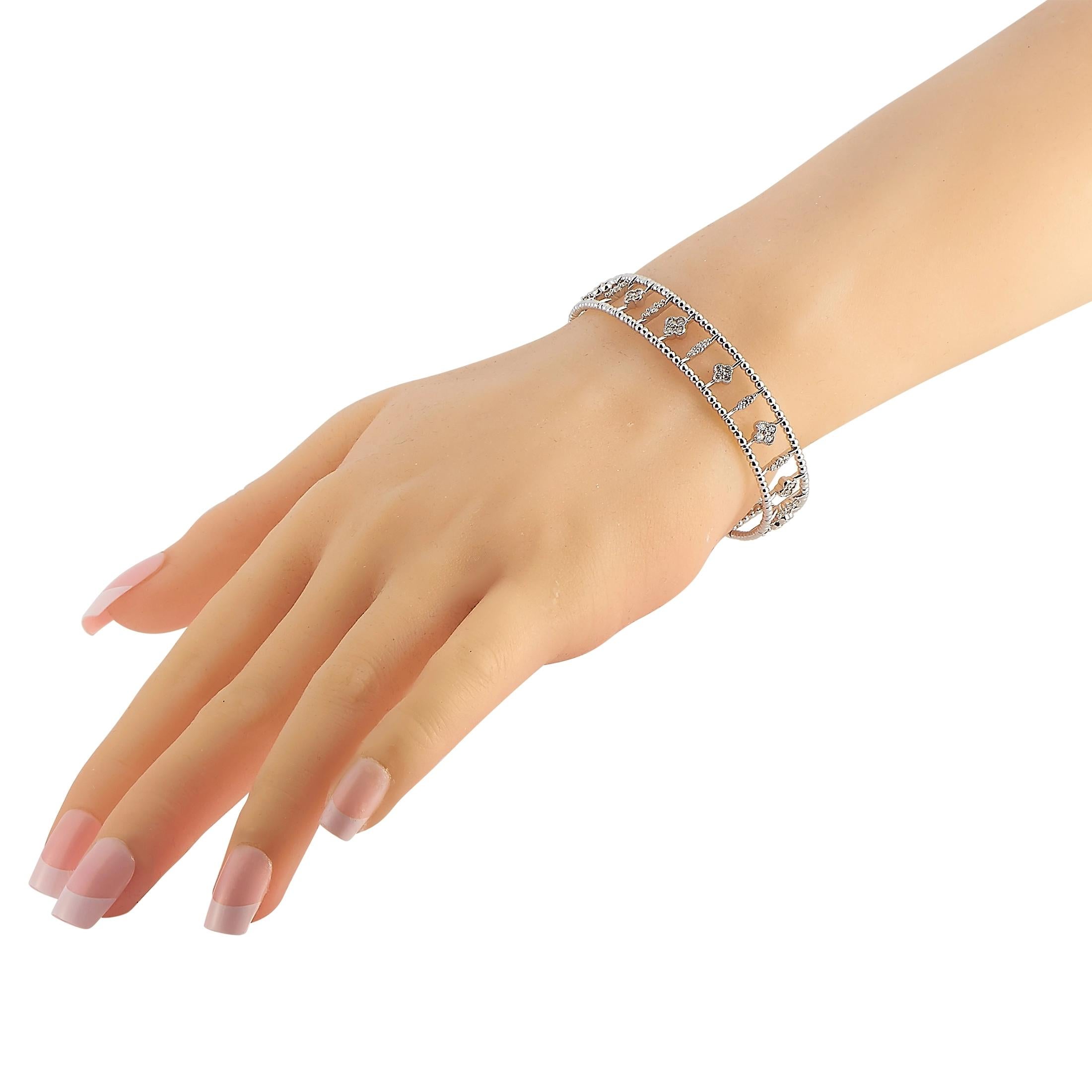 Add an instant chic factor to your most basic outfits with the LB Exclusive Dainty Flower 14K White Gold 1.22 ct Diamond Bangle. This cool white gold bangle features a lovely row of alternating floral-themed columns held in between two delicately