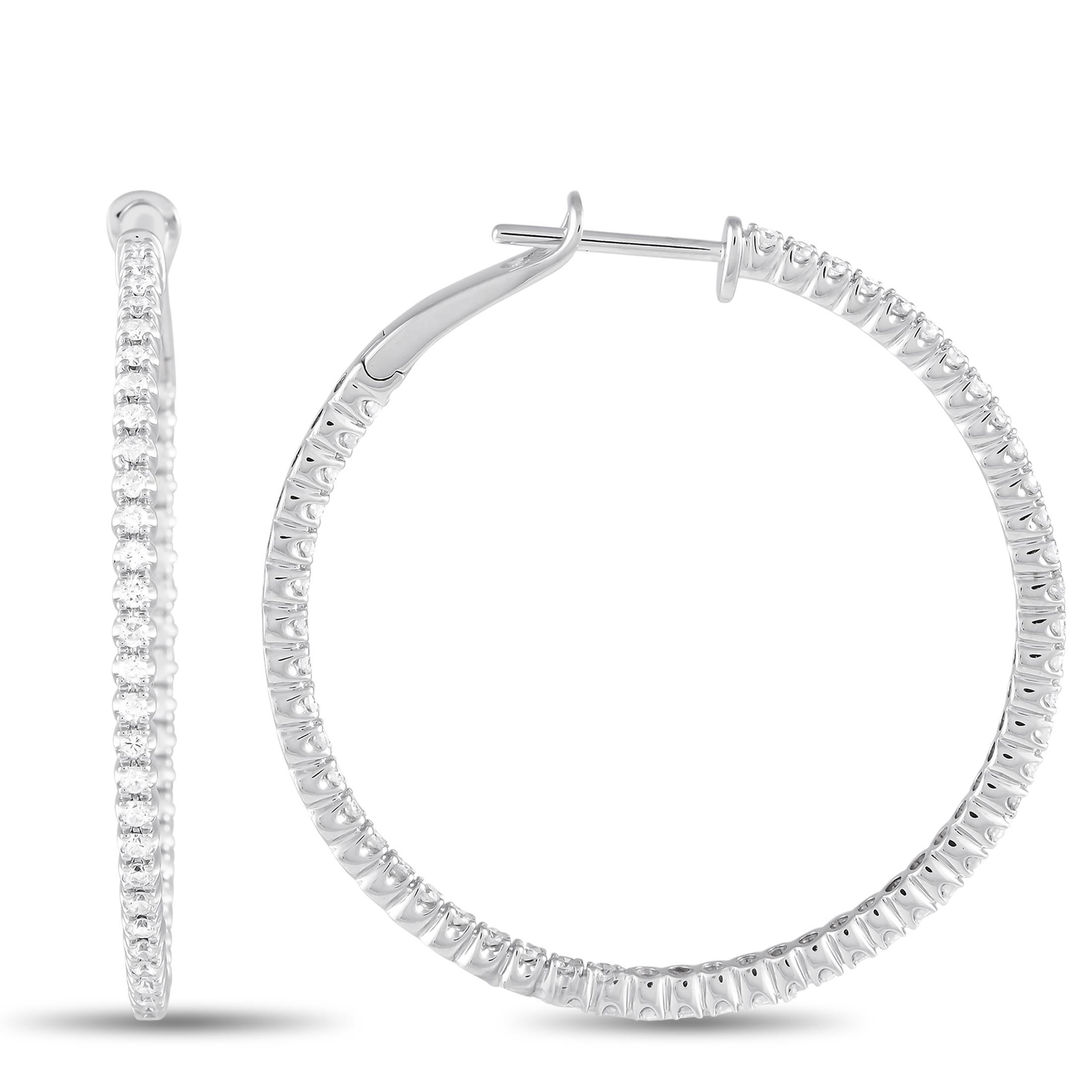 These luxurious hoop earrings will put the perfect finishing touch on any ensemble. Covered in sparkling diamonds with a total weight of 1.32 carats, each 14K White Gold setting measures 1.5\u201d round.\r\nThis jewelry piece is offered in brand new