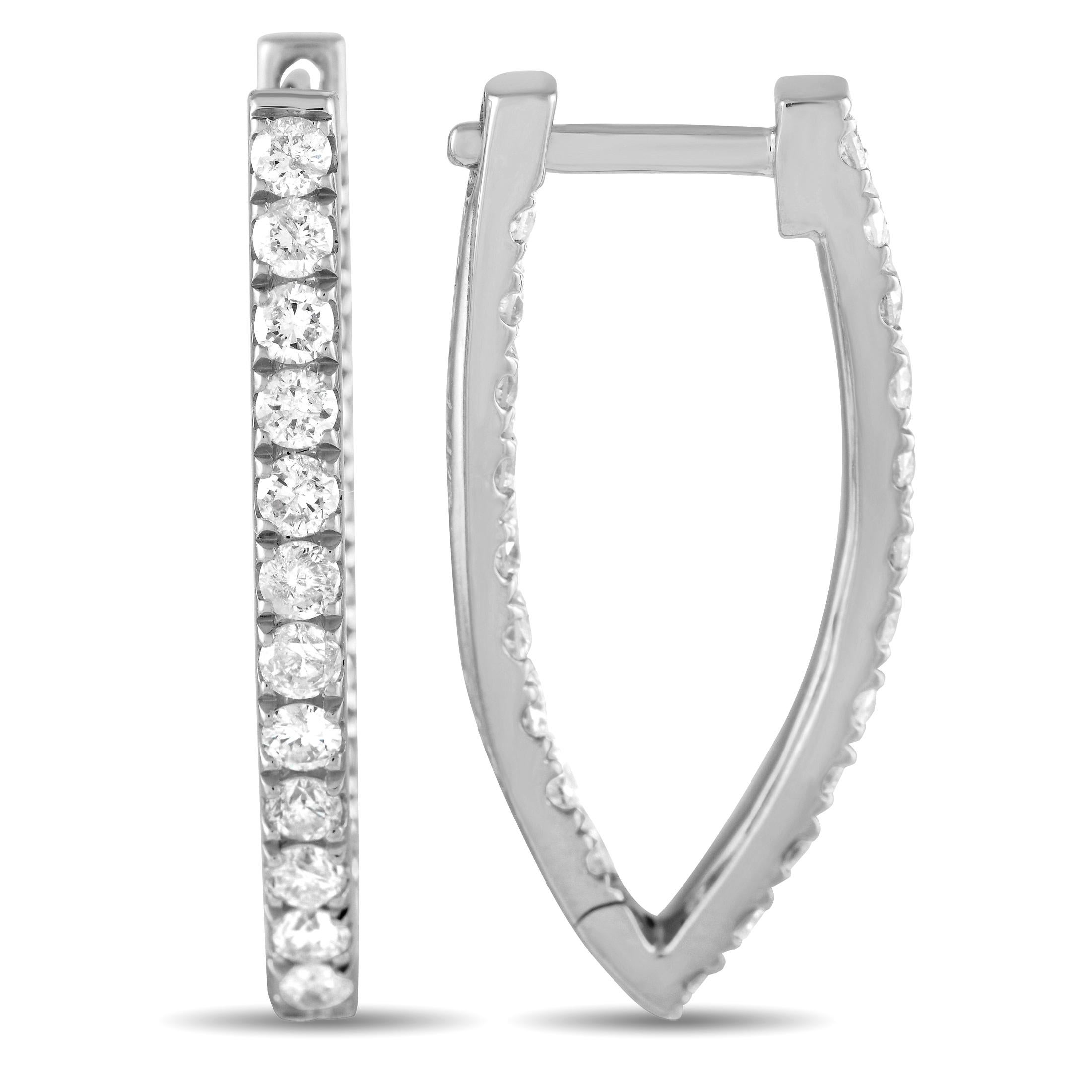 No jewelry box will be complete without diamond hoops. Make sure you add this dazzling pair to your collection. Each 14K white gold earring measures 1 by 0.50 and weighs 1.9 grams. Sparkling diamonds run along each hoop's front-facing outer and