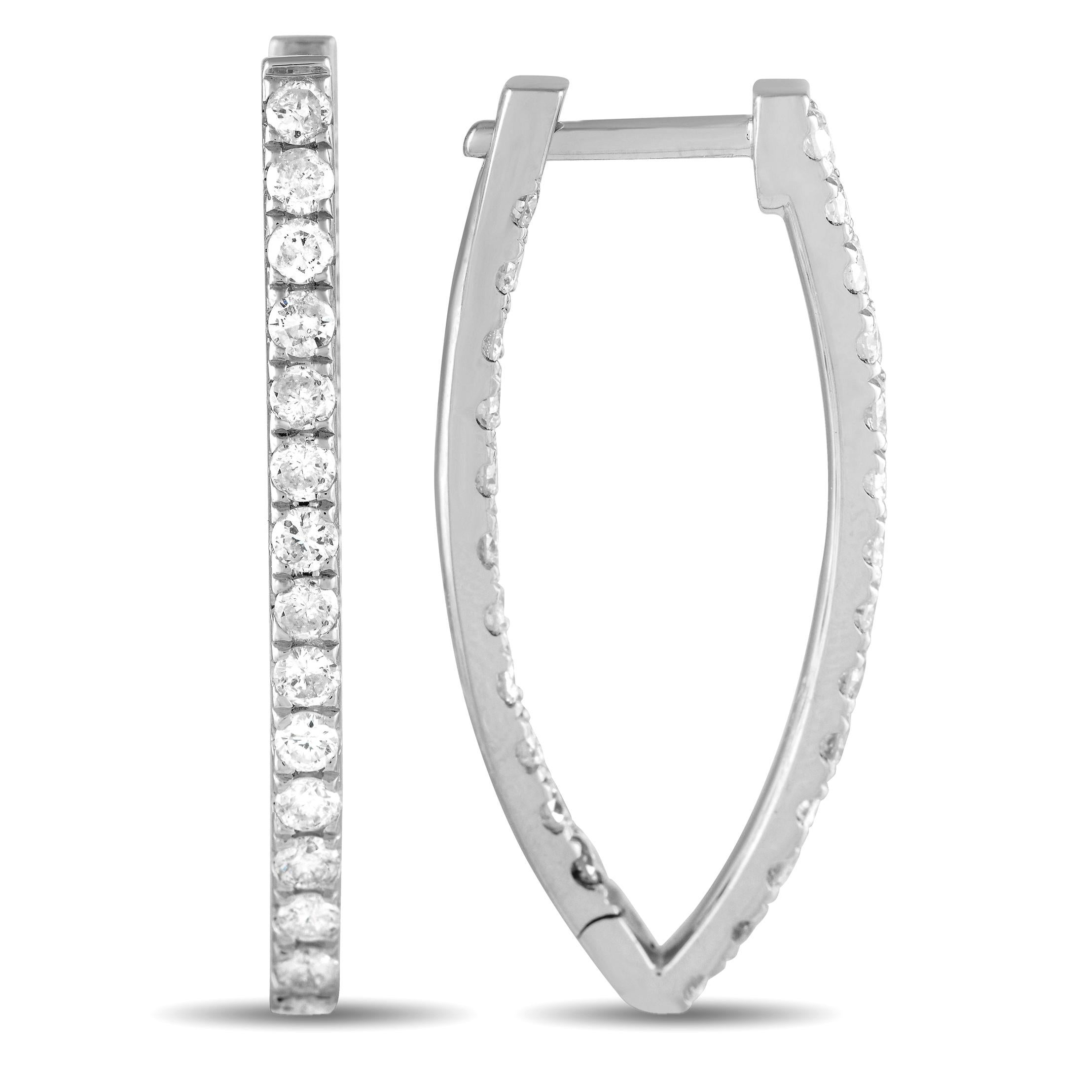 This lustrous pair of diamond hoops is sure to add glamour to your dressiest looks. Each hoop measures 1.25 by 0.60 and has a hinged snap closure. These earrings have an inside-out design where round diamonds run along the inner and outer front