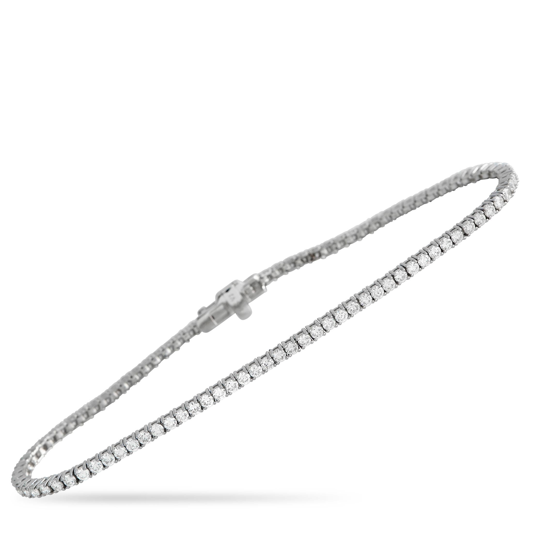 Mark a special day with the beautiful sparkle of this LB Exclusive 14K White Gold 2.51 ct Diamond Tennis Bracelet. The 7.25-inch long bracelet is lined with 1.81 carats of white diamonds. A box tab secures this glittering piece to the wrist. 

This