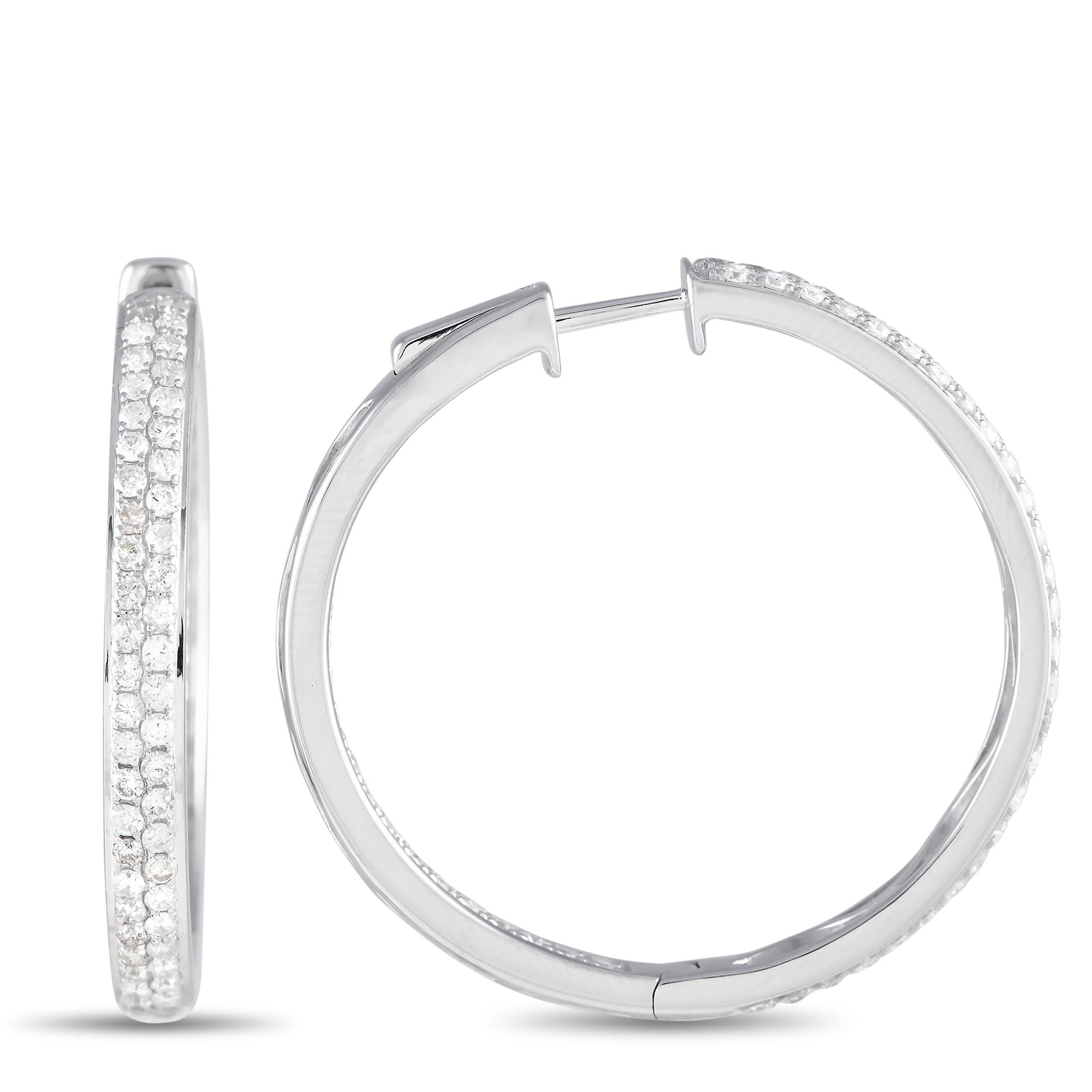 Look and feel more put together with this pair of diamond hoop earrings. Crafted in 14K white gold, these 1.25-inch hoops has its front exterior and back interior surfaces lined with two rows of round diamonds. Timeless and versatile, this pair of