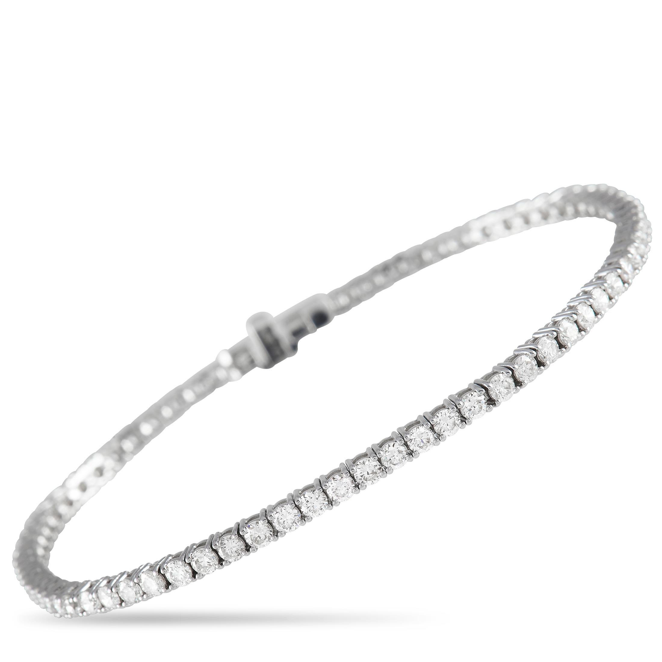 A series of sparkling diamonds totaling 2.45 carats provides this tennis bracelet with its classic sense of elegance. Measuring 7.5” long, this timeless design features an understated 14K White Gold setting that allows the luxurious gemstones to