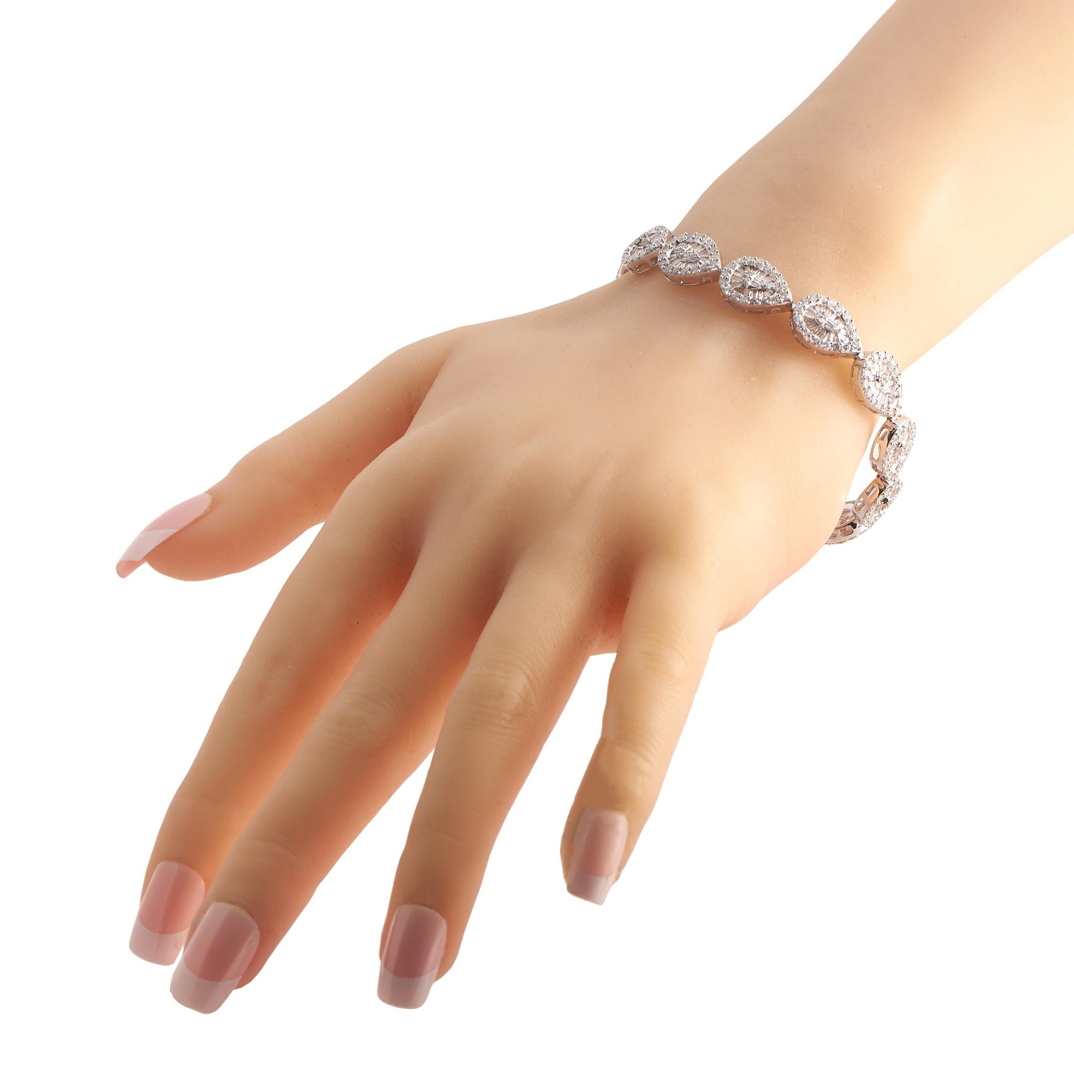 A series of pear-shaped 14K white gold links give this luxury bracelet its signature design. Stylish and incredibly sophisticated, this piece measures 7.25 long and includes sparkling diamonds with a total weight of 6.05 carats.This jewelry piece is
