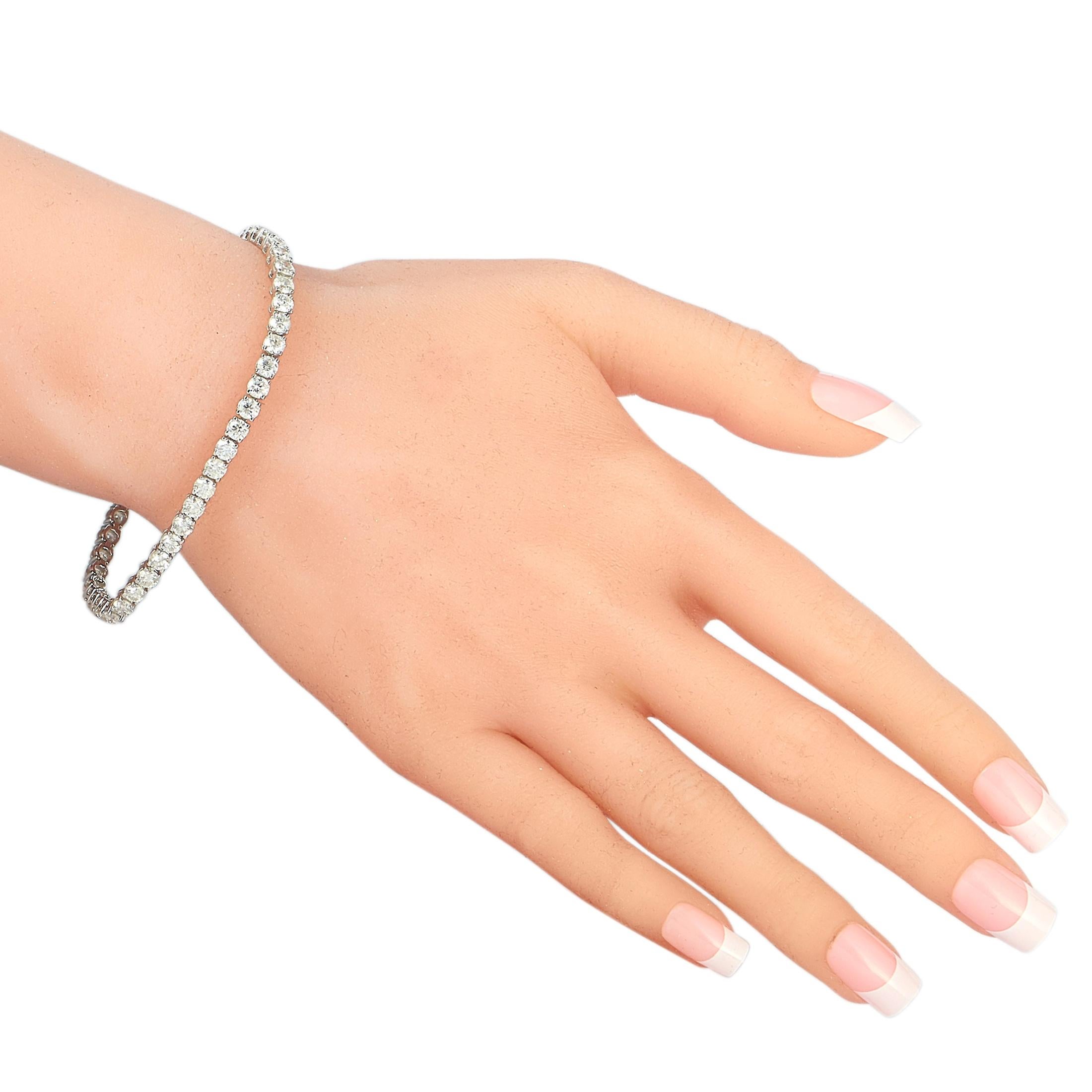 This LB Exclusive tennis bracelet is made of 14K white gold and embellished with diamonds that amount to 9.26 carats. The bracelet weighs 12.9 grams and measures 7.25” in length.
 
 Offered in brand new condition, this jewelry piece includes a gift