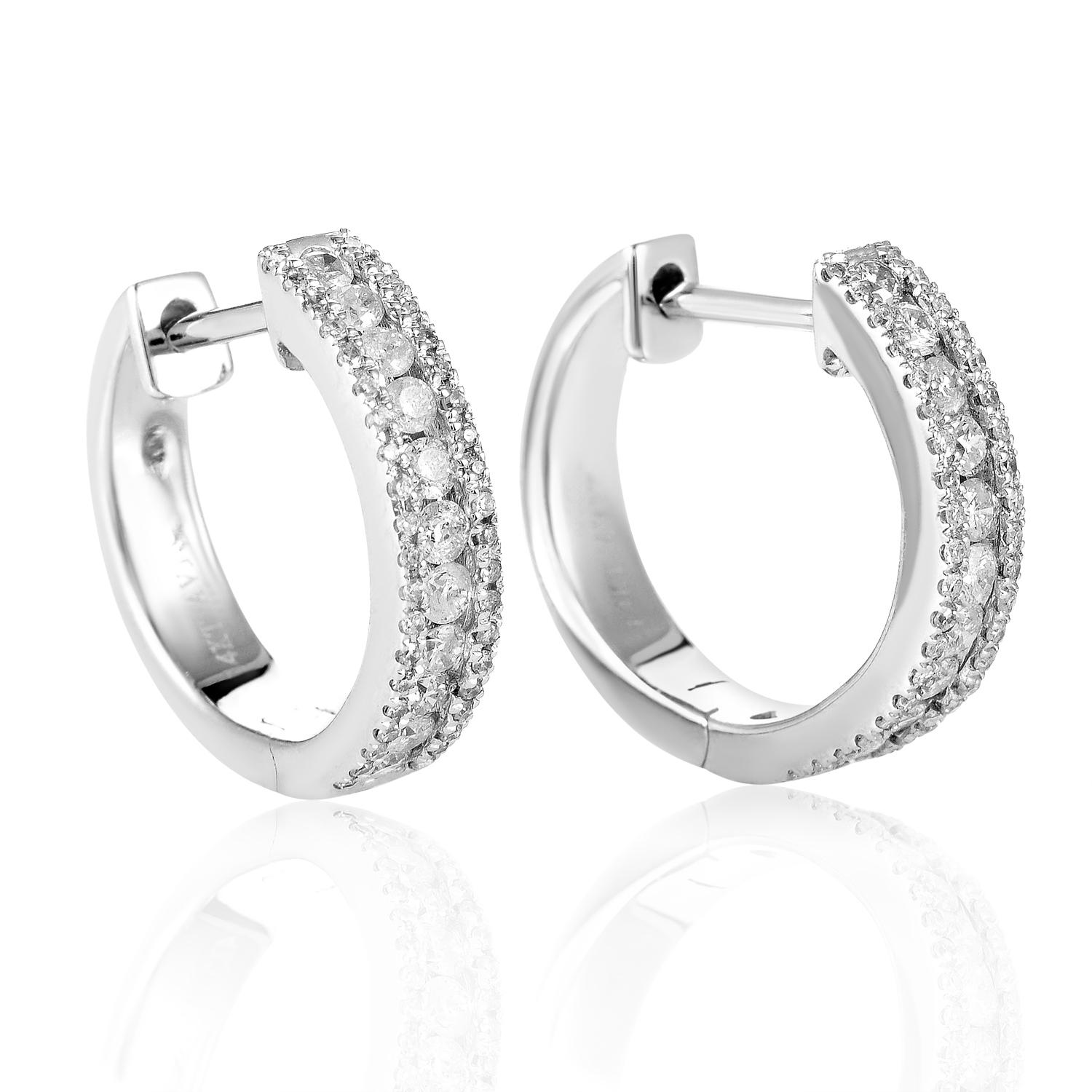Catching your eye with their marvelous resplendence and revealing the true beauty of their intricate design upon a closer look, these nifty earrings are made of 14K white gold and lined with lustrous diamonds totaling 0.70ct.