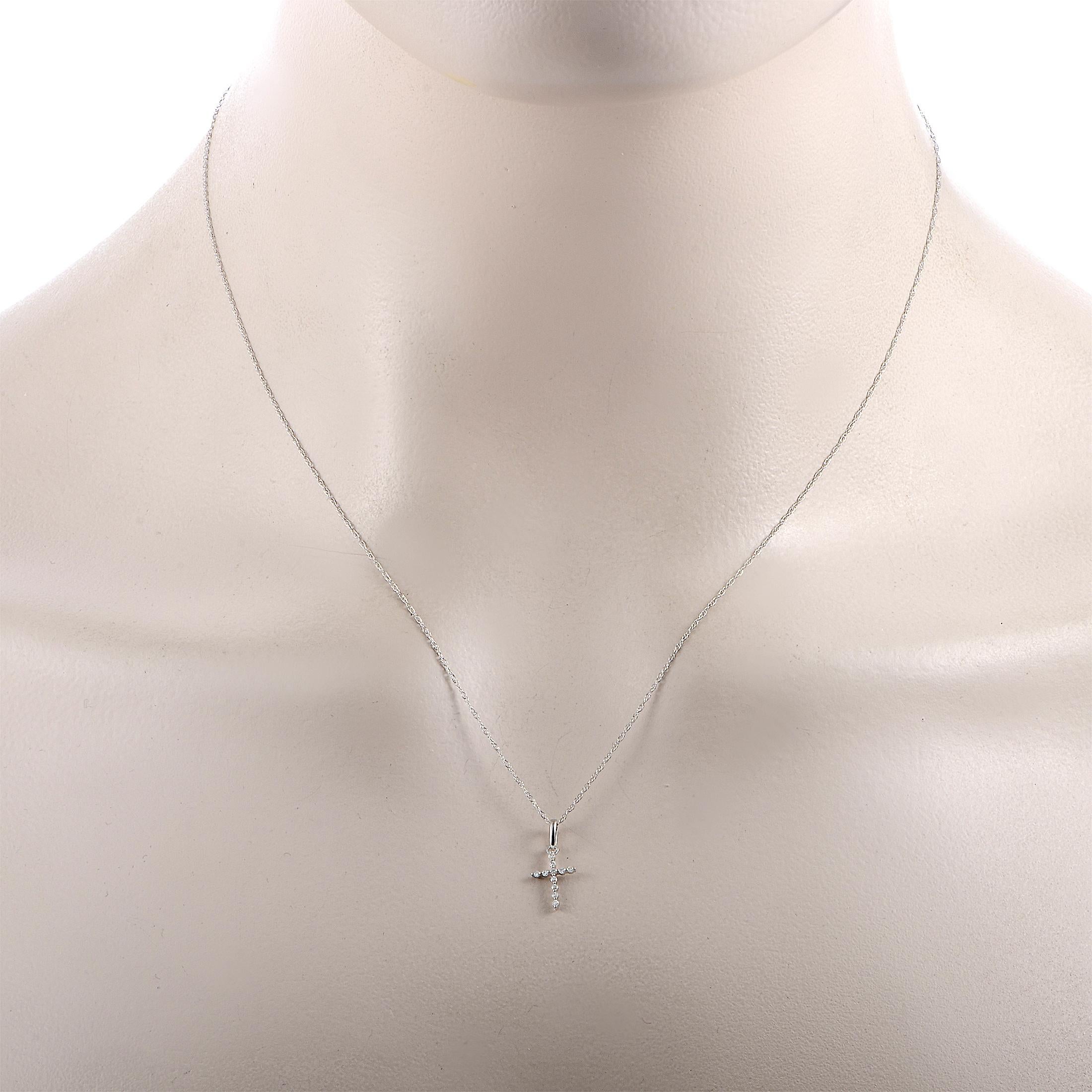 This LB Exclusive necklace is made of 14K white gold and set with a total of 0.05 carats of diamonds. Weighing 0.7 grams, the necklace is presented with an 18” chain featuring spring ring closure and a cross pendant that measures 0.50” in length and