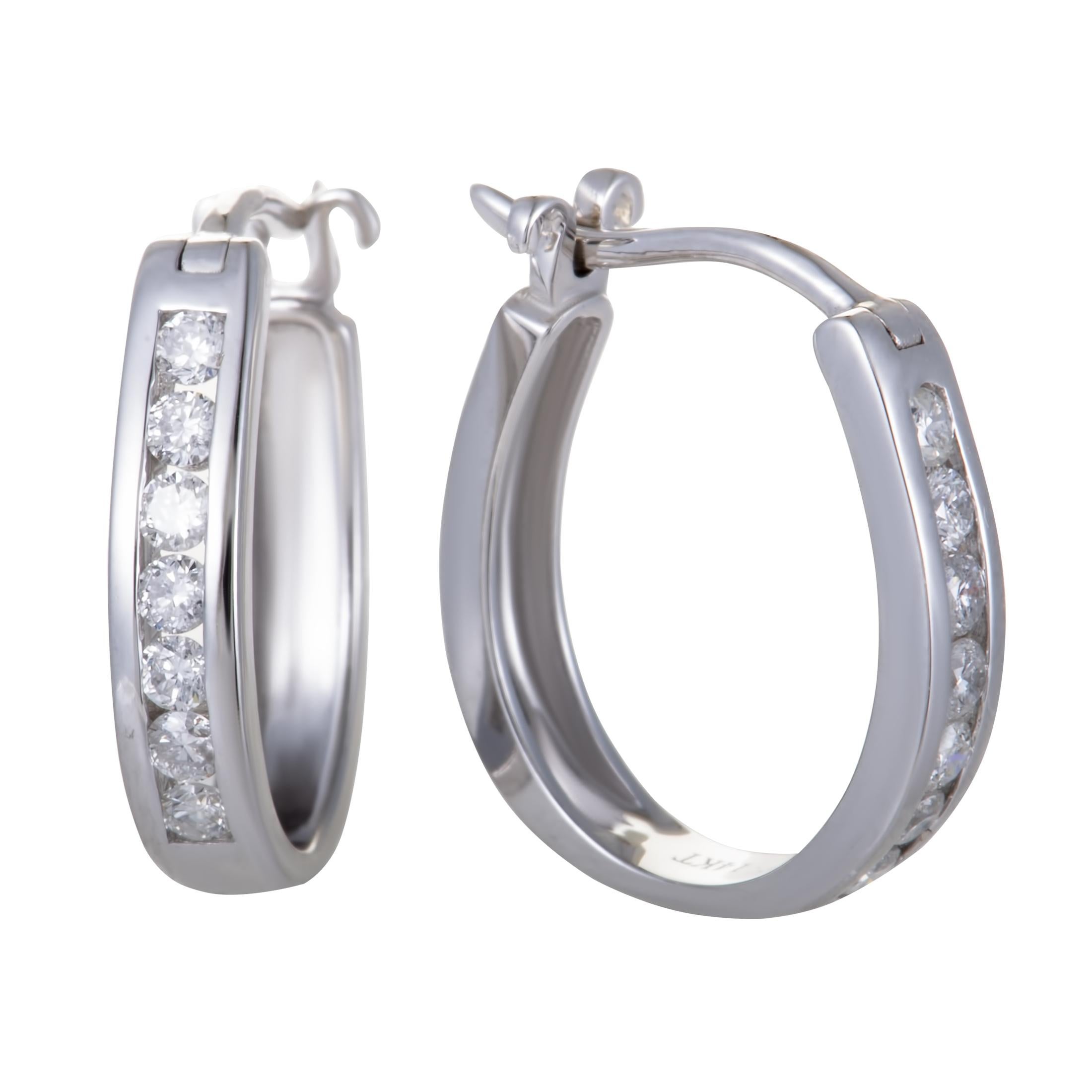 The elegantly gleaming 14K white gold and the luxuriously glistening diamond stones complement each other wonderfully in these gorgeous hoop earrings that offer a delightfully classy appearance. The pair weighs 2.6 grams and the diamonds total 0.33