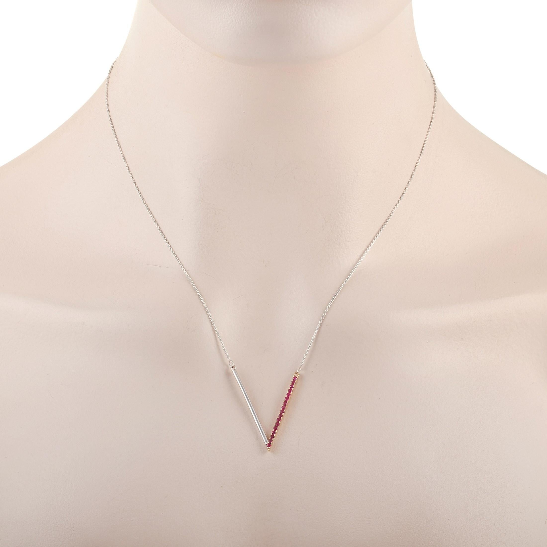 This LB Exclusive 14K White Gold 0.29 ct Ruby Necklace features a delicate 14K White Gold chain measuring 16 inches in length. The necklace features a matching 14K White Gold V-shaped Pendant set with 0.29 carats of round-cut rubies along one side.
