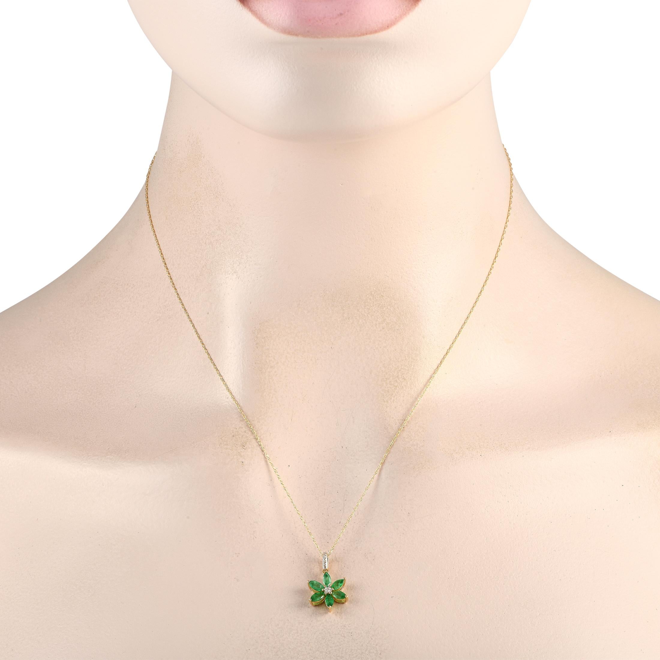 A floral shaped pendant measuring 0.75 long by 0.50 wide is suspended from an 18 chain on this charming necklace. Crafted from 14K Yellow Gold, the pendant comes to life thanks to captivating Emerald petals and Diamonds with a total weight of 0.01