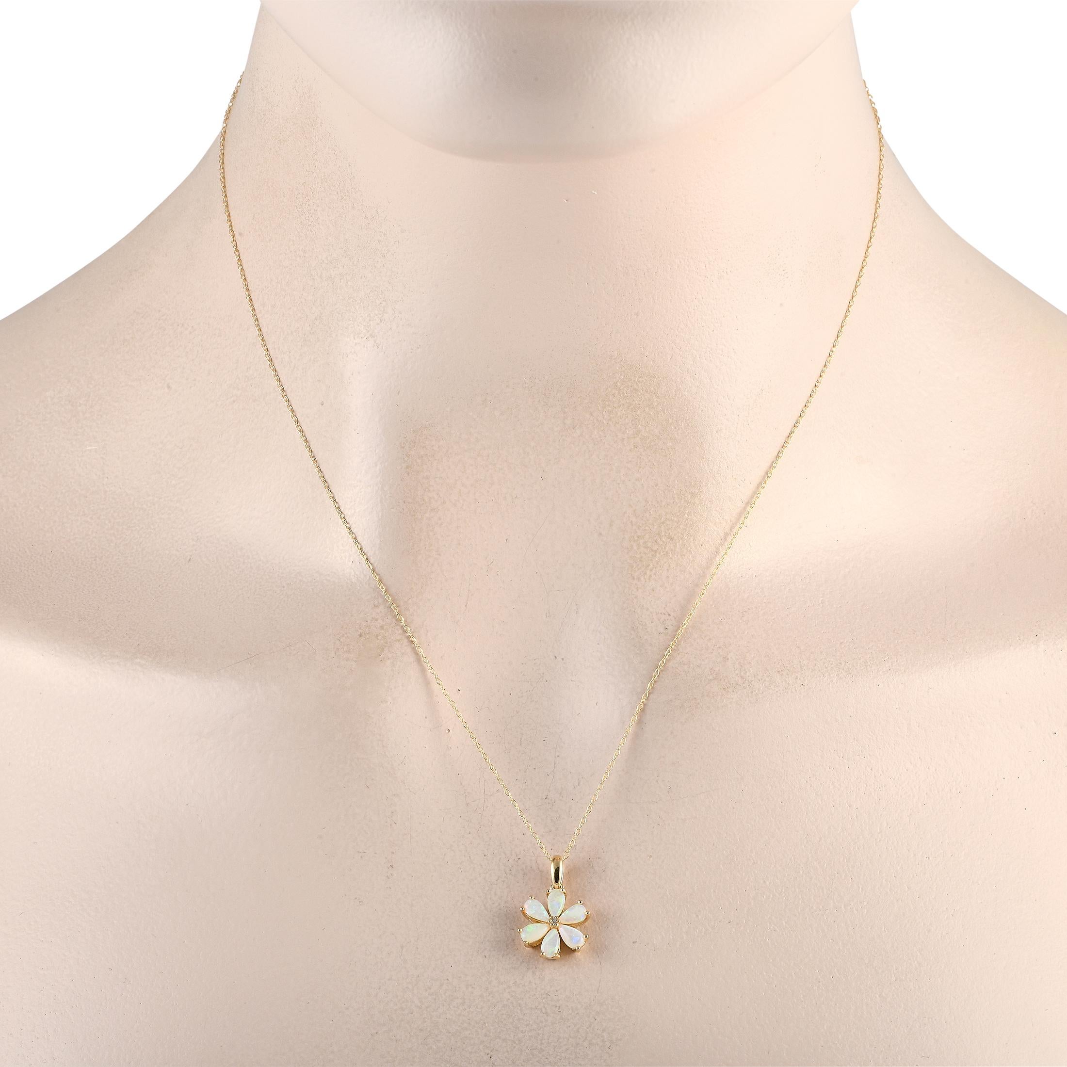 A floral shaped pendant makes a statement on this simple, elegant necklace. Crafted from 14K yellow gold, the pendant comes to life thanks to radiant opal petals and a single 0.01 carat diamond stone at the center. It measures 0.75 long by 0.50 wide
