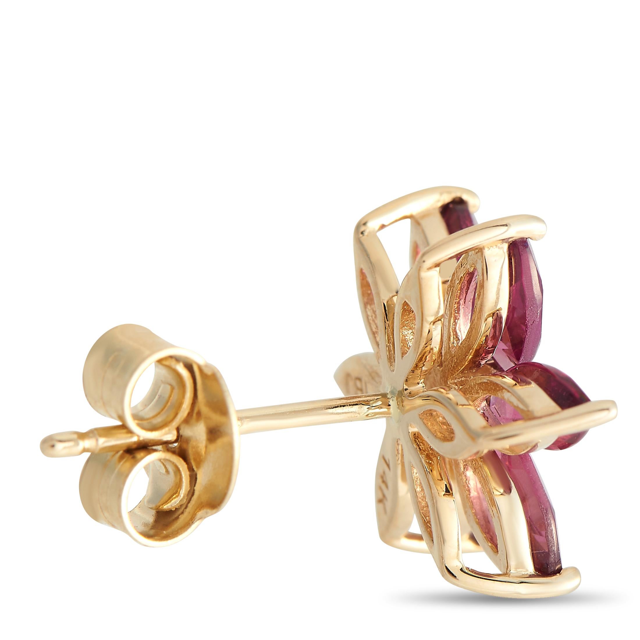 These floral earrings offer an easy way to add a small, feminine touch to your outfits. Each stud has a flower basket setting with six marquise-cut rhodolite petals. A diamond sits at the center, providing a subtle sparkle.Offered brand new, these