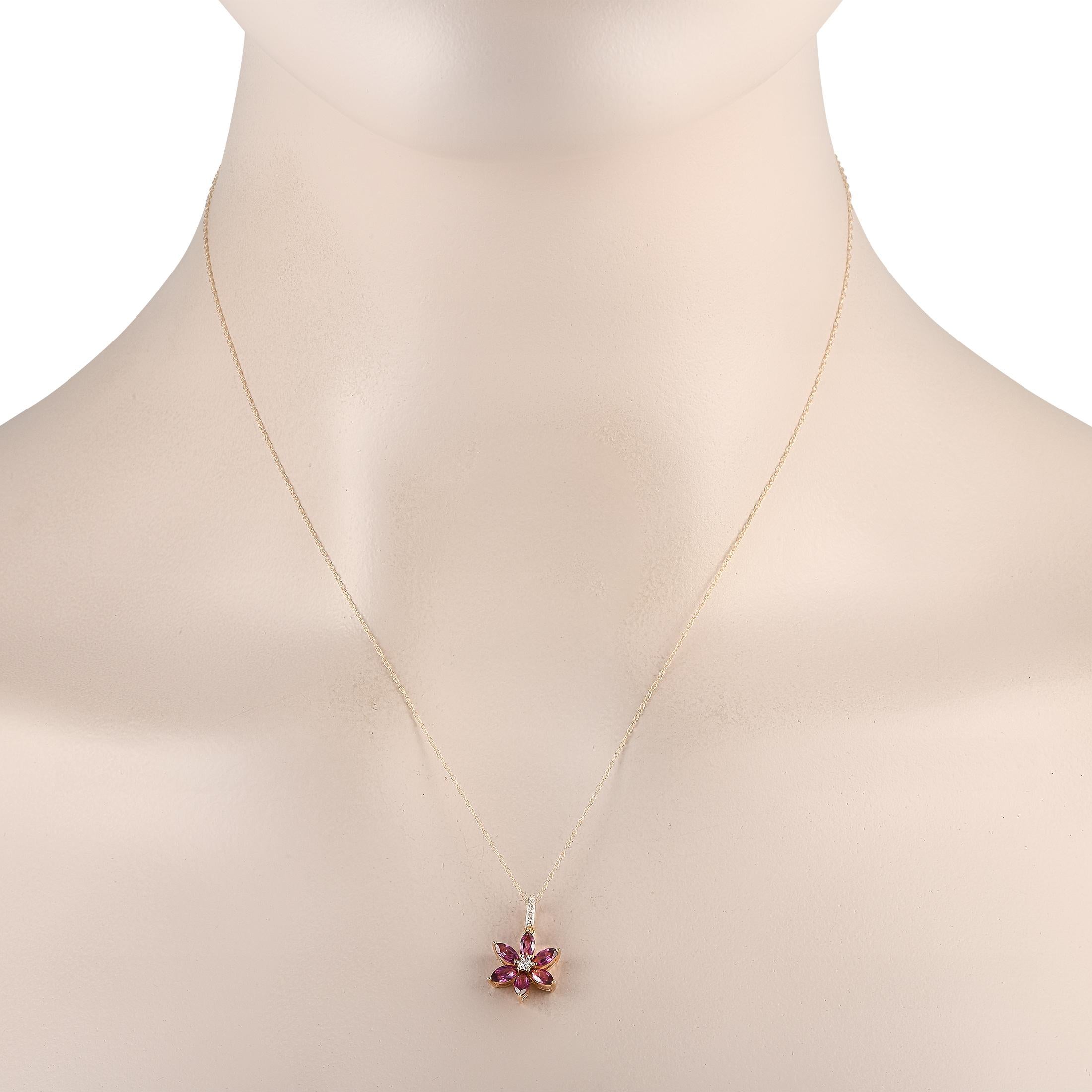 Your style is sure to bloom when you wear this diamond and rhodolite floral necklace. This LB Exclusive piece in 14K yellow gold features a diamond-traced bail holding a six-petal pendant measuring 0.75 by 0.50. The flower pendant has a diamond