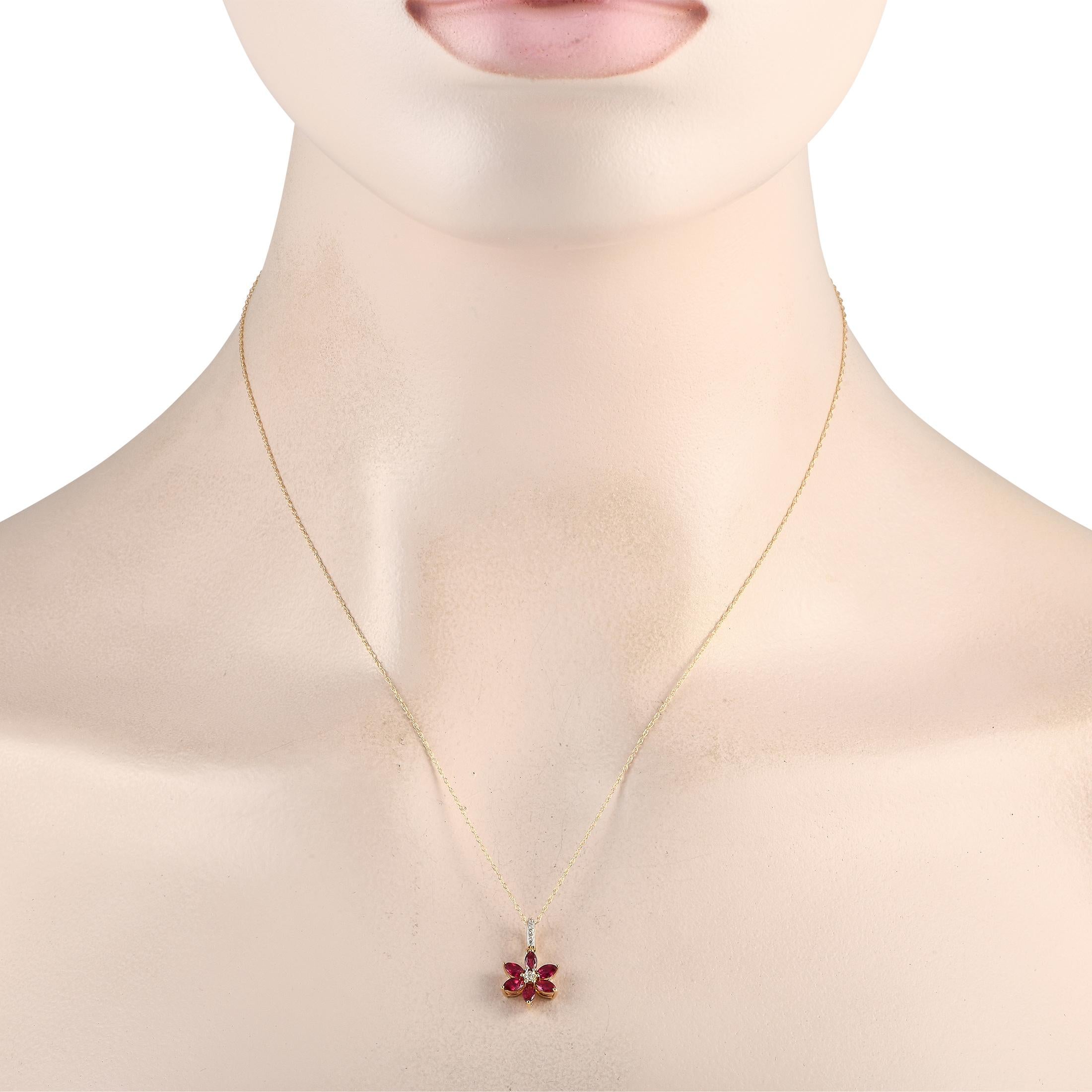 Bring any ensemble to life with this luxurious 14K Yellow Gold necklace. On this exquisite accessory, the floral-shaped pendant features radiant Ruby petals and Diamonds with a total weight of 0.01 carats. The pendant measures 0.75 long by 0.50 wide