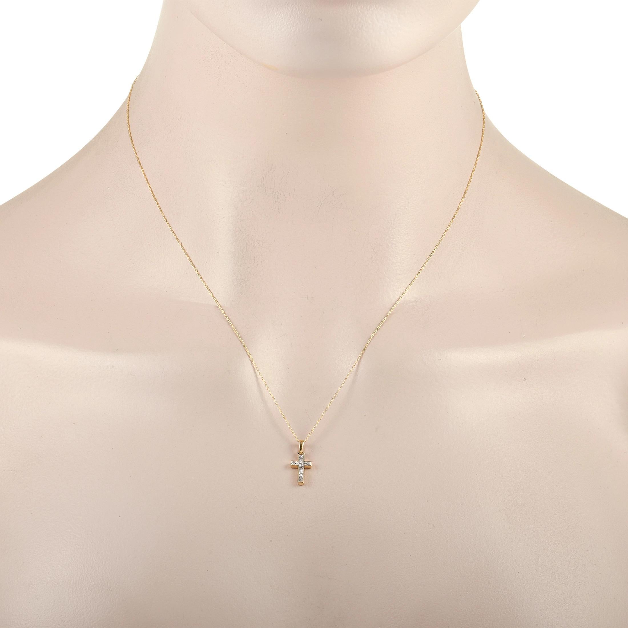 This glittering diamond cross necklace puts a luxurious twist on an iconic piece of jewelry. A 14K Yellow Gold setting contrasts beautifully with the sleek, elegant cross shaped pendant measuring .63” long and .25” wide. It’s suspended from a 17.5”