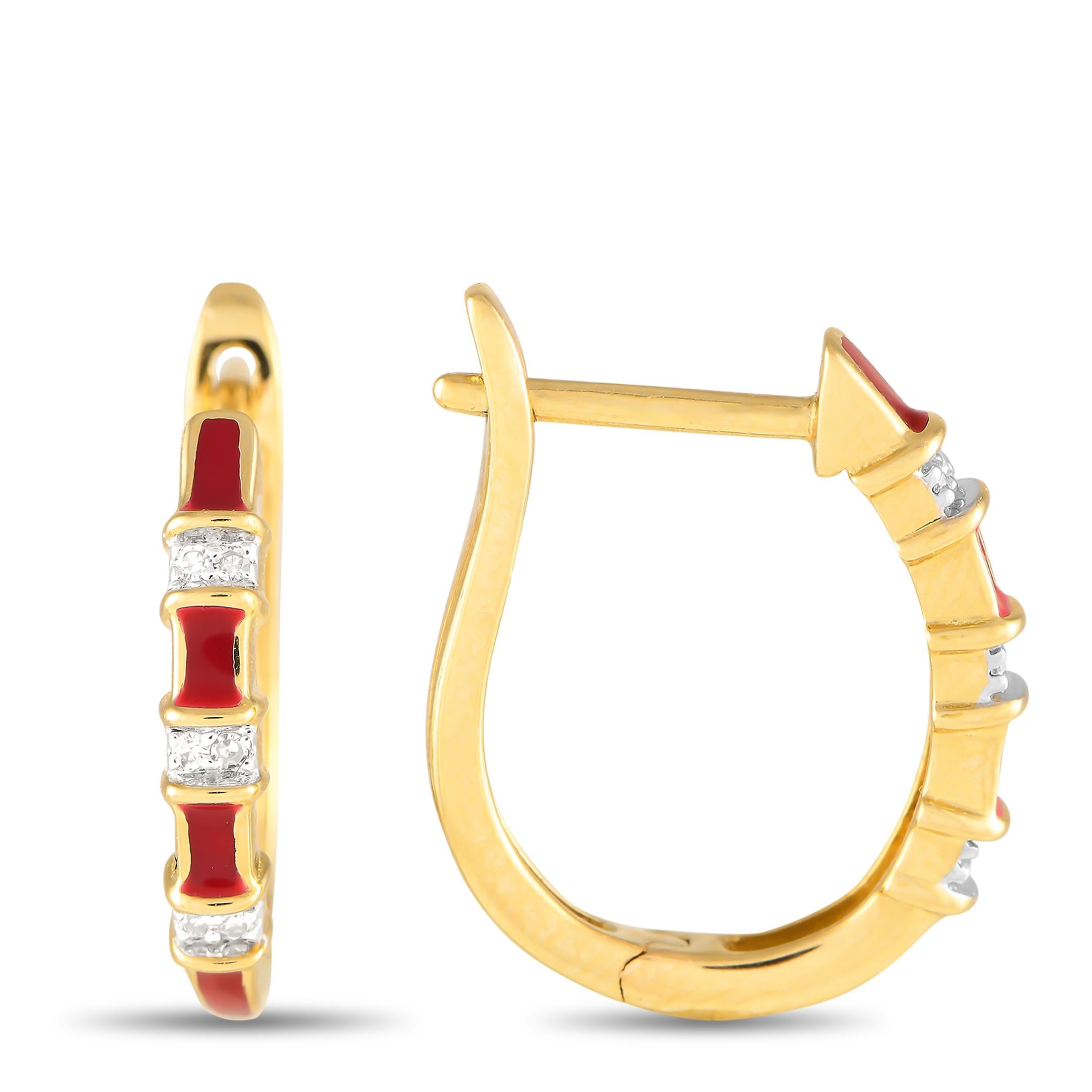 Red enamel accents make these simple, elegant earrings instantly captivating. Each one features a classic 14K Yellow Gold setting measuring 0.65 long by 0.50 wide. Diamonds with a total weight of 0.05 carats provide just a touch of extra