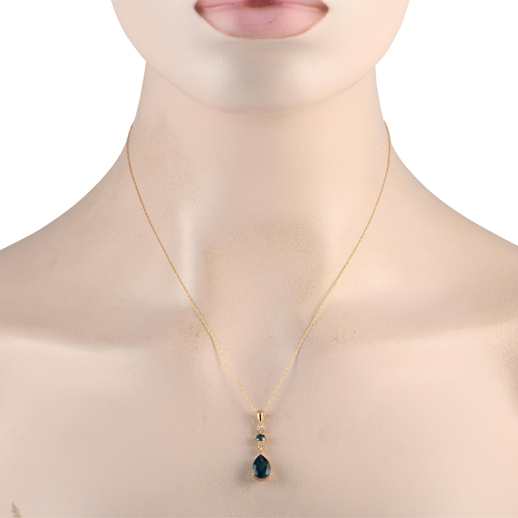 A pair of stunning Blue Topaz gemstones serve as a stunning focal point on this elegant necklace. Simple and stylish, this piece features a 14K Yellow Gold pendant measuring 1.25 long by 0.25 wide. Diamonds with a total weight of 0.05 carats provide