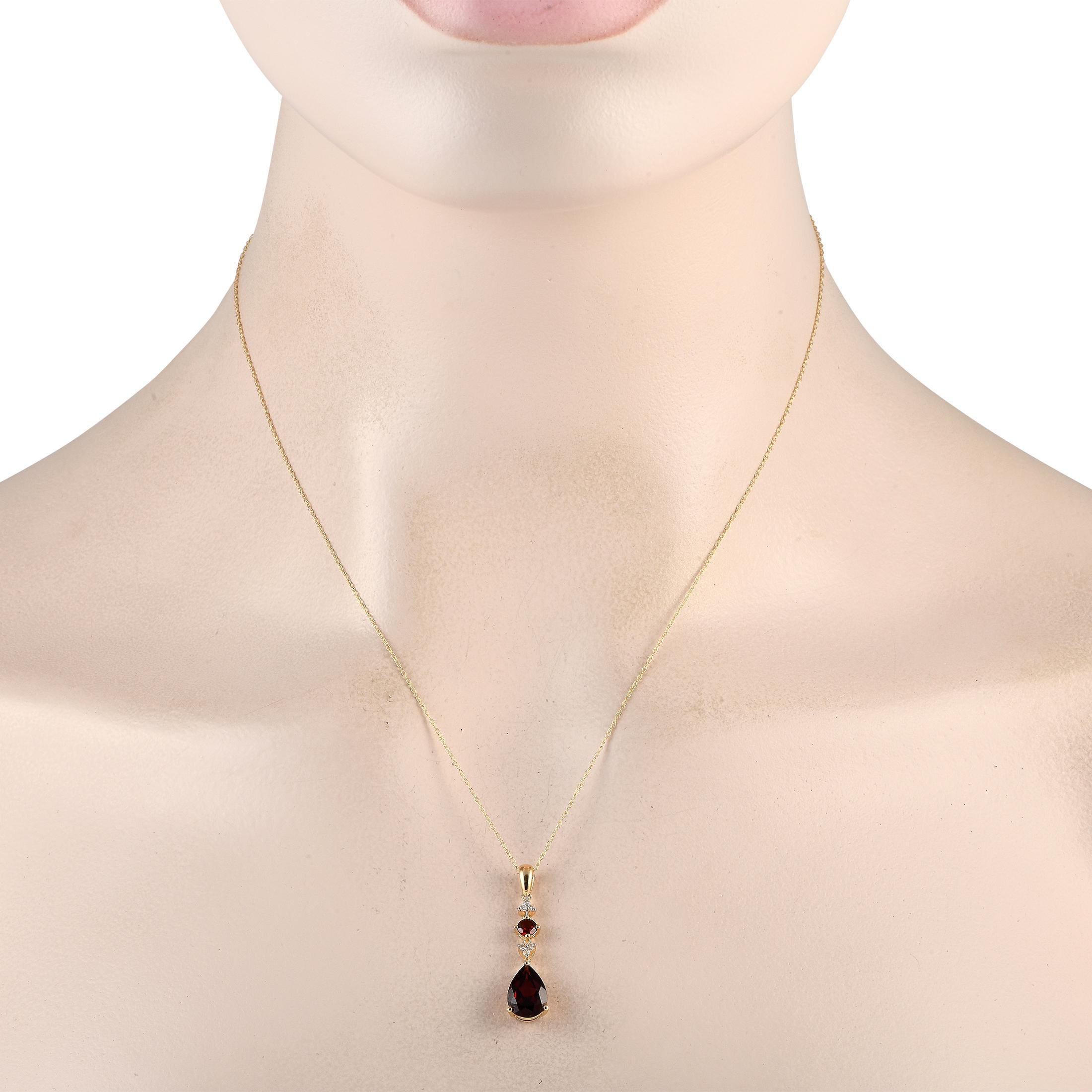 Add a touch of sophistication to any ensemble with this simple, elegant necklace. Suspended from an 18 chain, youll find a 14K Yellow Gold pendant measuring 1.25 long and 0.25 wide. Captivating Garnet gemstones add a dash of color, while sparkling