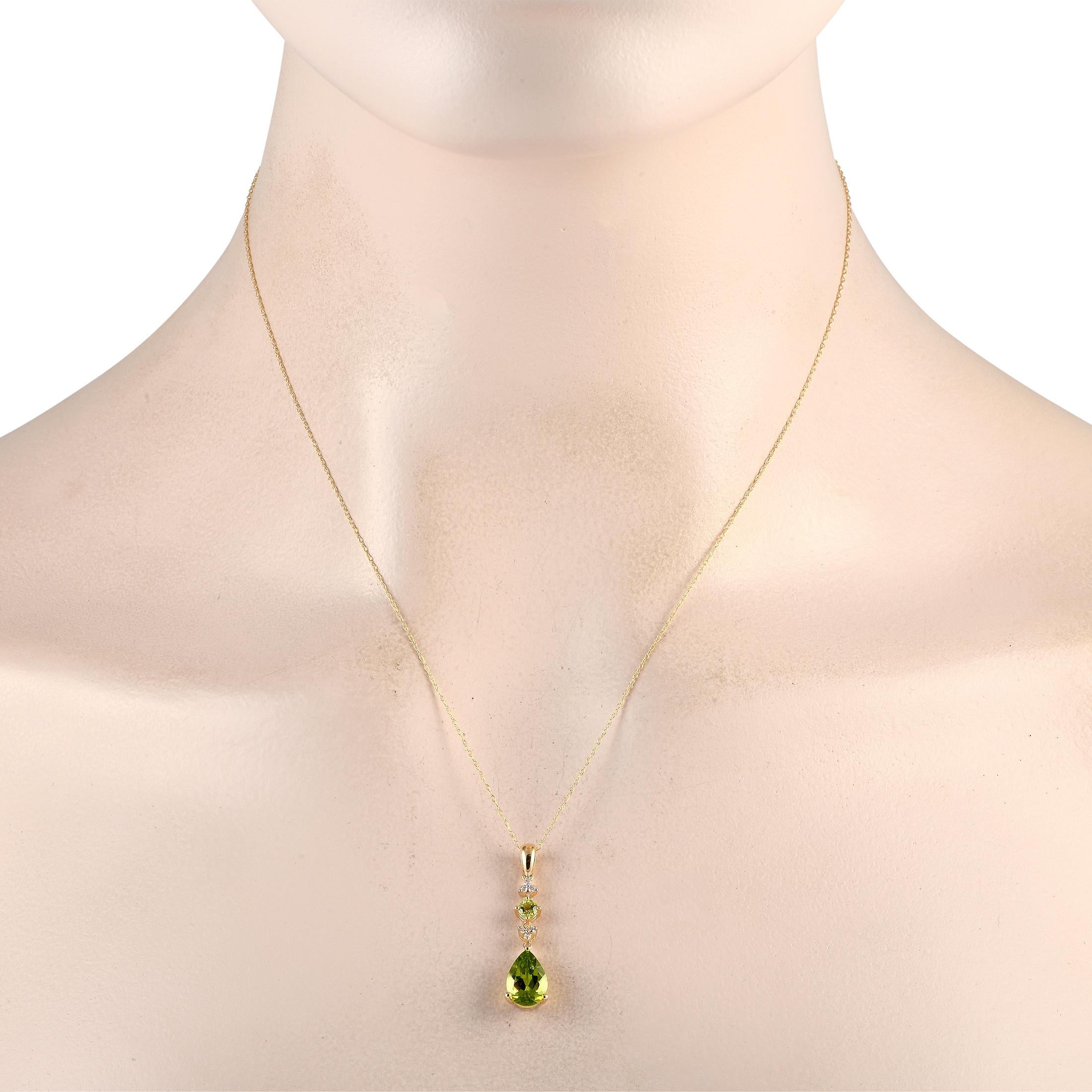 This dynamic necklace will elevate any ensemble. Bright green Peridot gemstones add a splash of color to this sophisticated accessory, while Diamonds totaling 0.05 carats provide plenty of extra sparkle. The 14K Yellow Gold pendant measures 1.25