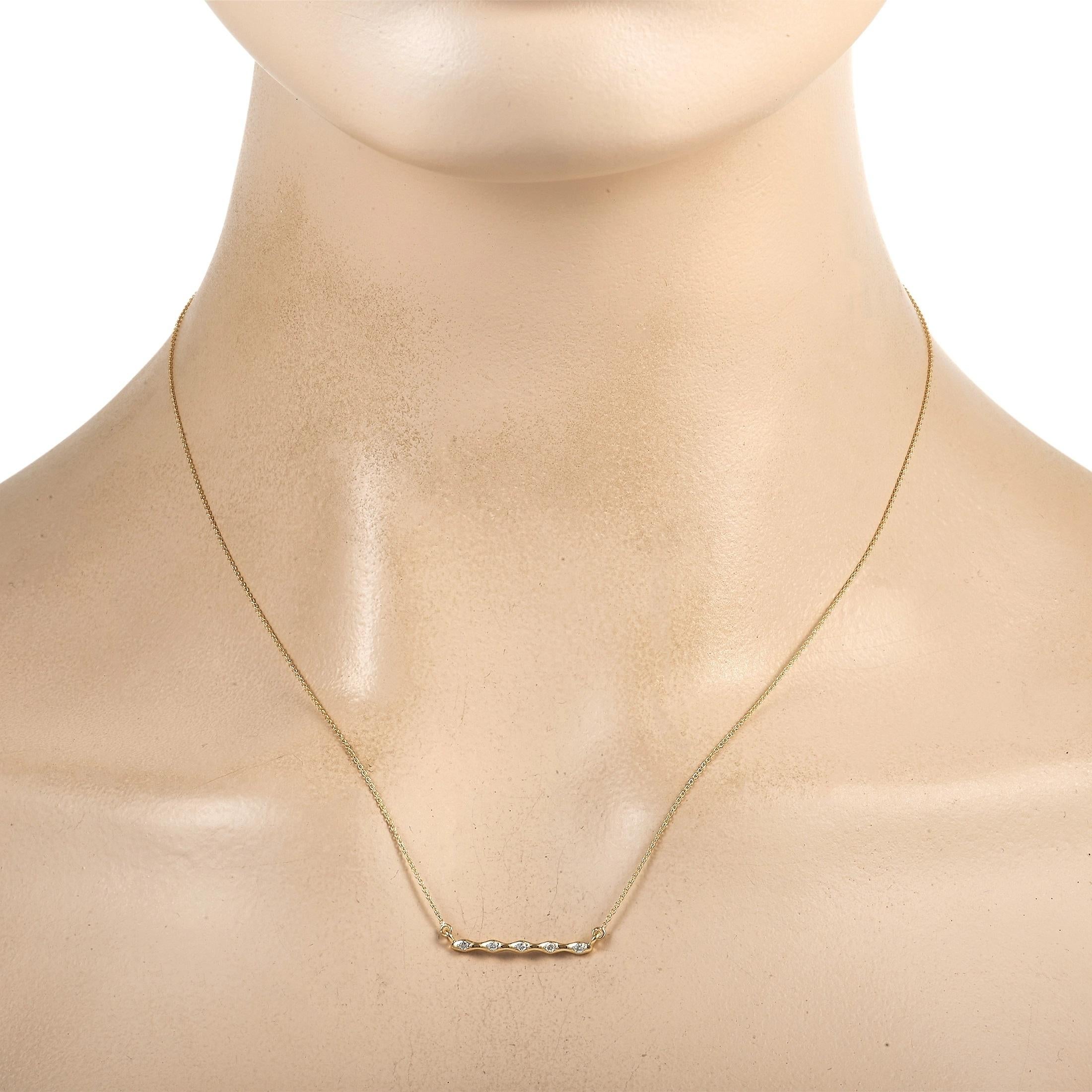 There’s something enchanting about this sleek, sophisticated necklace. Crafted from 14K Yellow Gold, the simple pendant measures 0.85” long, 0.07” wide, and is adorned with glittering diamonds totaling 0.06 carats. It’s suspended at the center of a