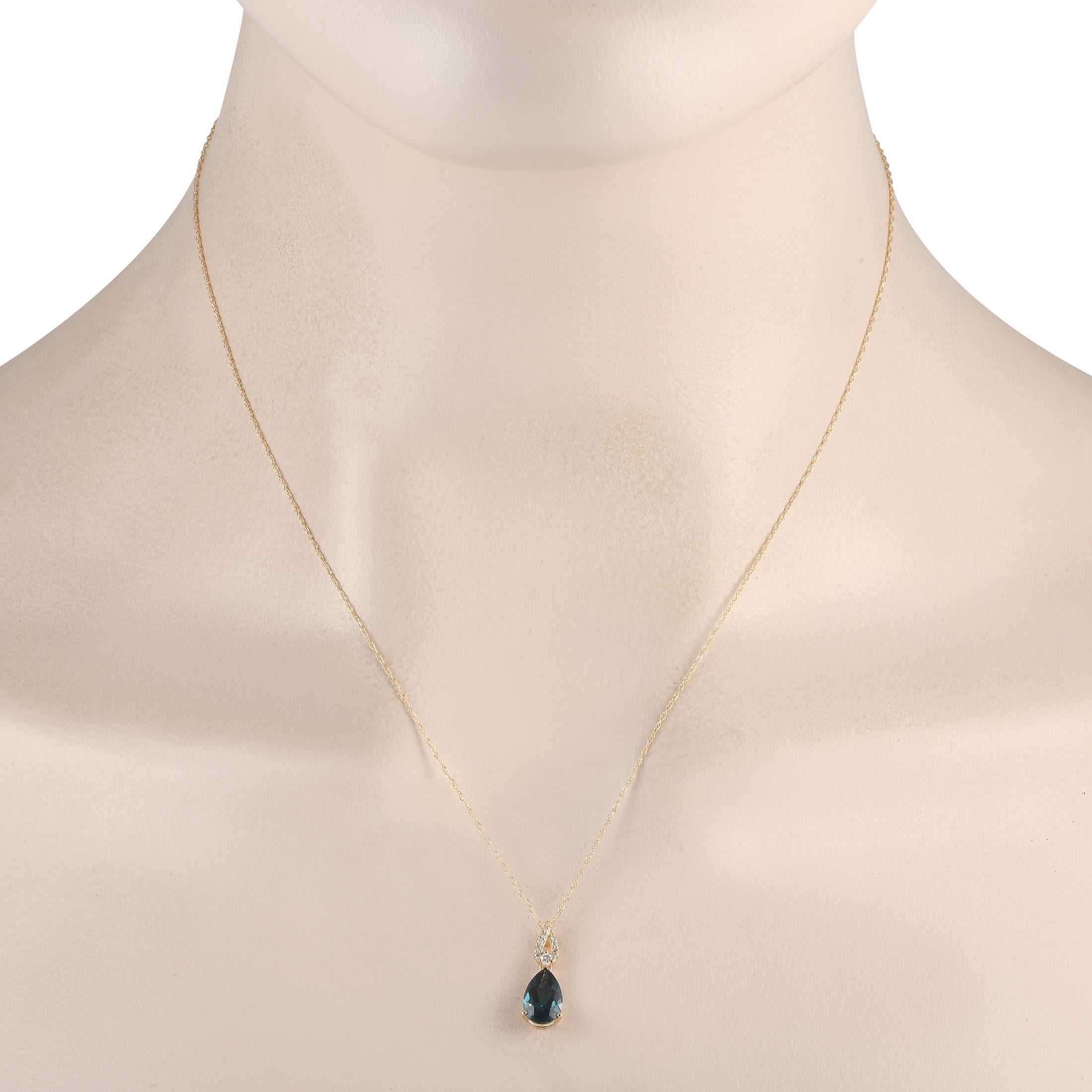 A pear-shaped Blue Topaz adds a pop of color to this sleek, sophisticated necklace. A 14K Yellow Gold pendant measuring 0.65 long by 0.25 wide is suspended from an 18 chain on this elegant accessory, which also includes sparkling Diamond accents