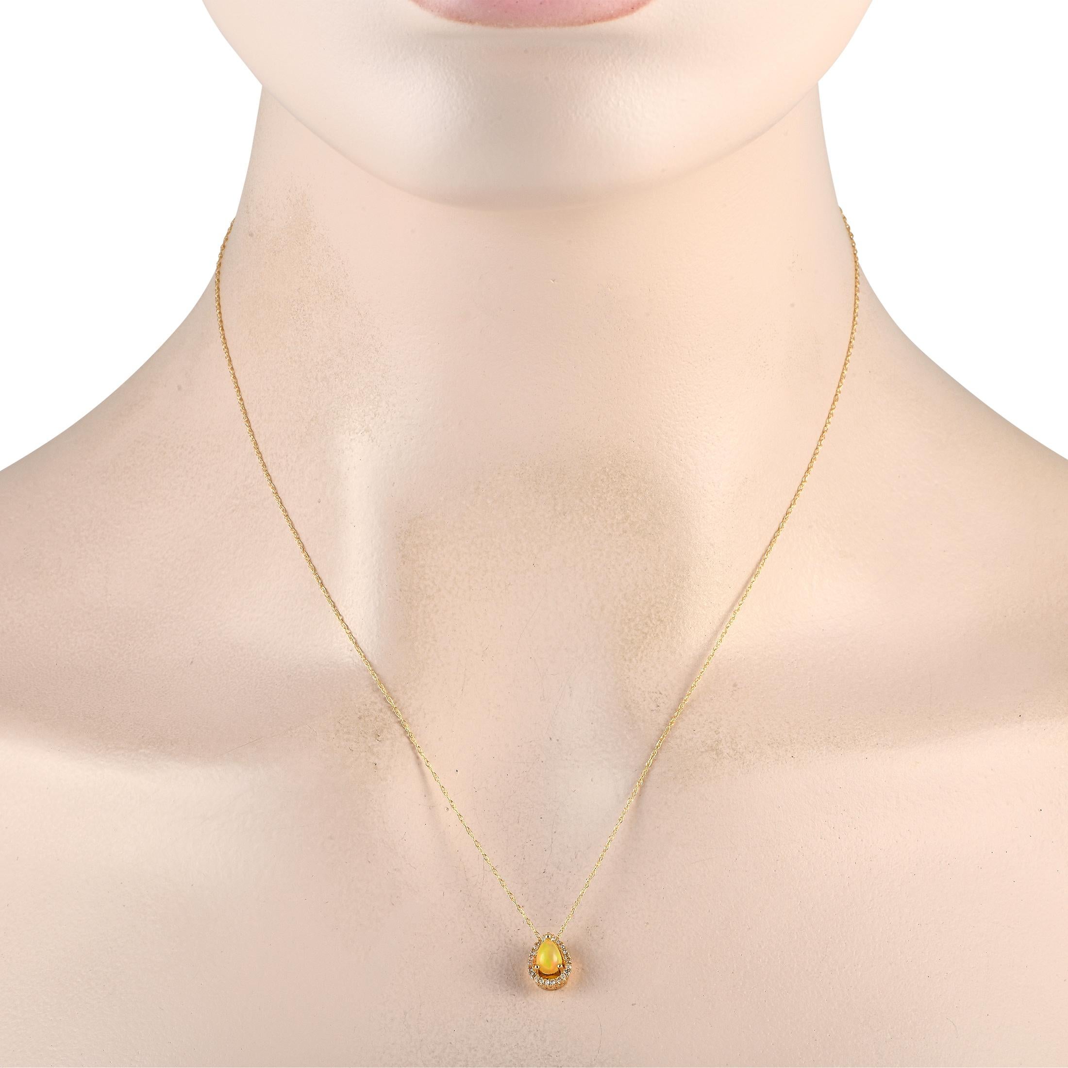 A captivating yellow Opal gemstone serves as a stunning focal point on this impeccably crafted necklace. This luxurious piece features a 14K Yellow Gold pendant measuring 0.45 long by 0.25 wide. Its suspended from an 18 chain and is also adorned