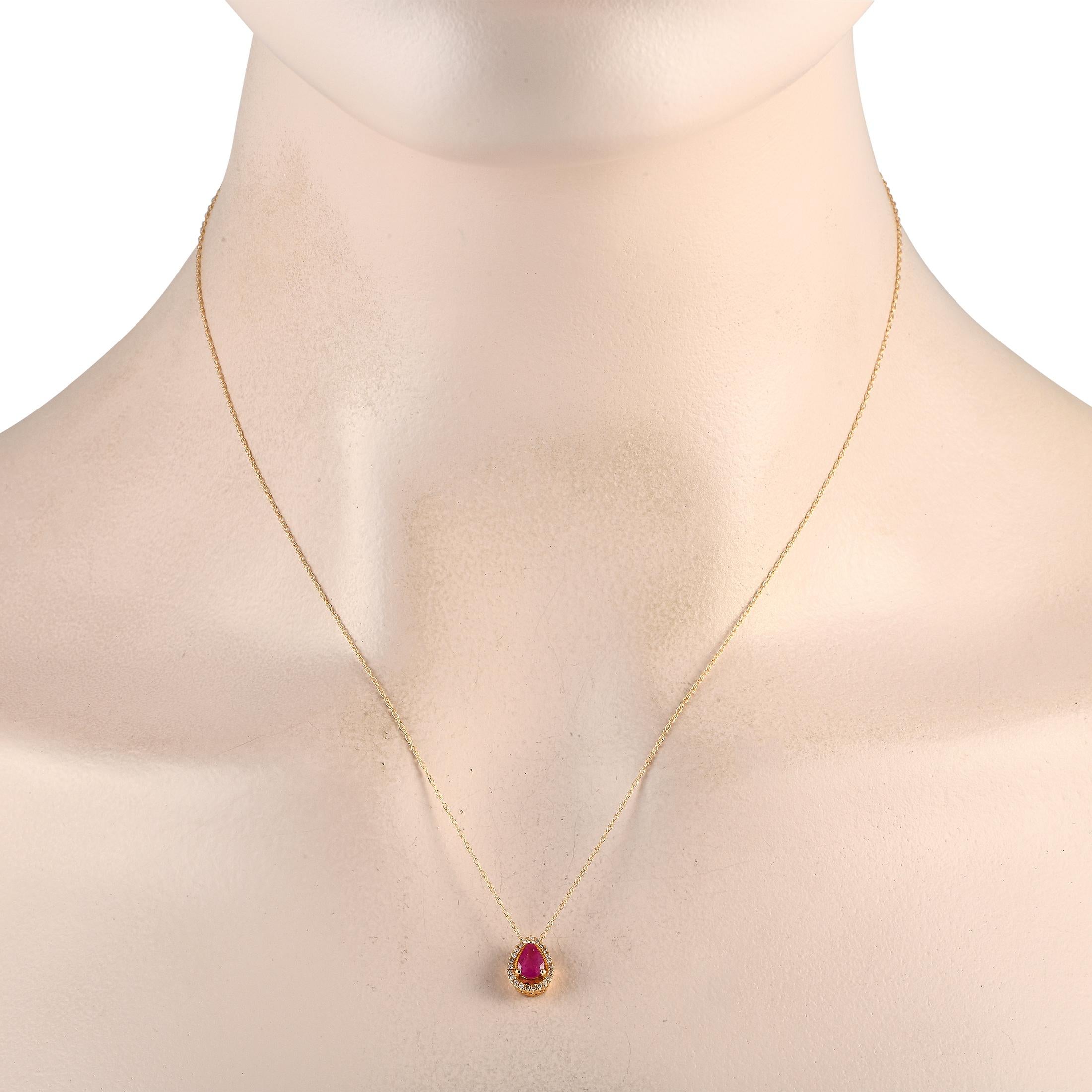 This luxurious necklace will never go out of style. On this piece, a 14K yellow gold pendant measuring 0.45 long by 0.25 wide is suspended from a delicate 18 chain. It includes a stunning ruby center stone and additional diamond accents totaling