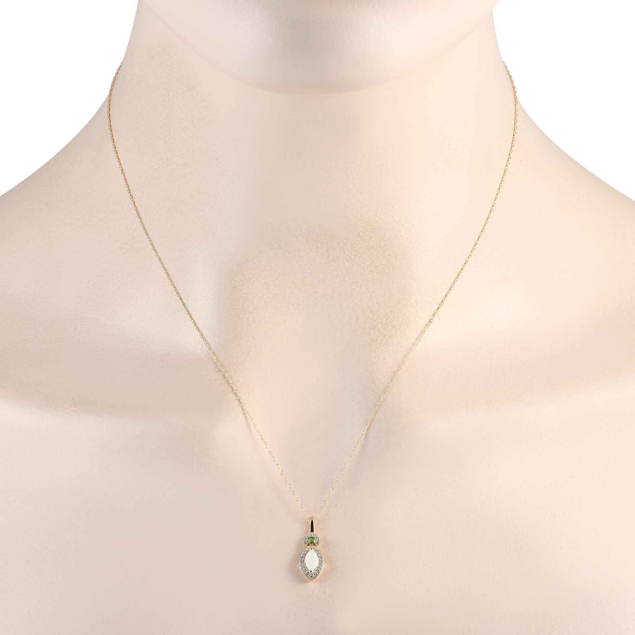 A stunning combination of gemstones makes this elegant necklace the perfect accessory. On this impeccably crafted piece of jewelry, a fiery opal, an emerald gemstone, and diamonds with a total weight of 0.07 carats come together in perfect harmony.
