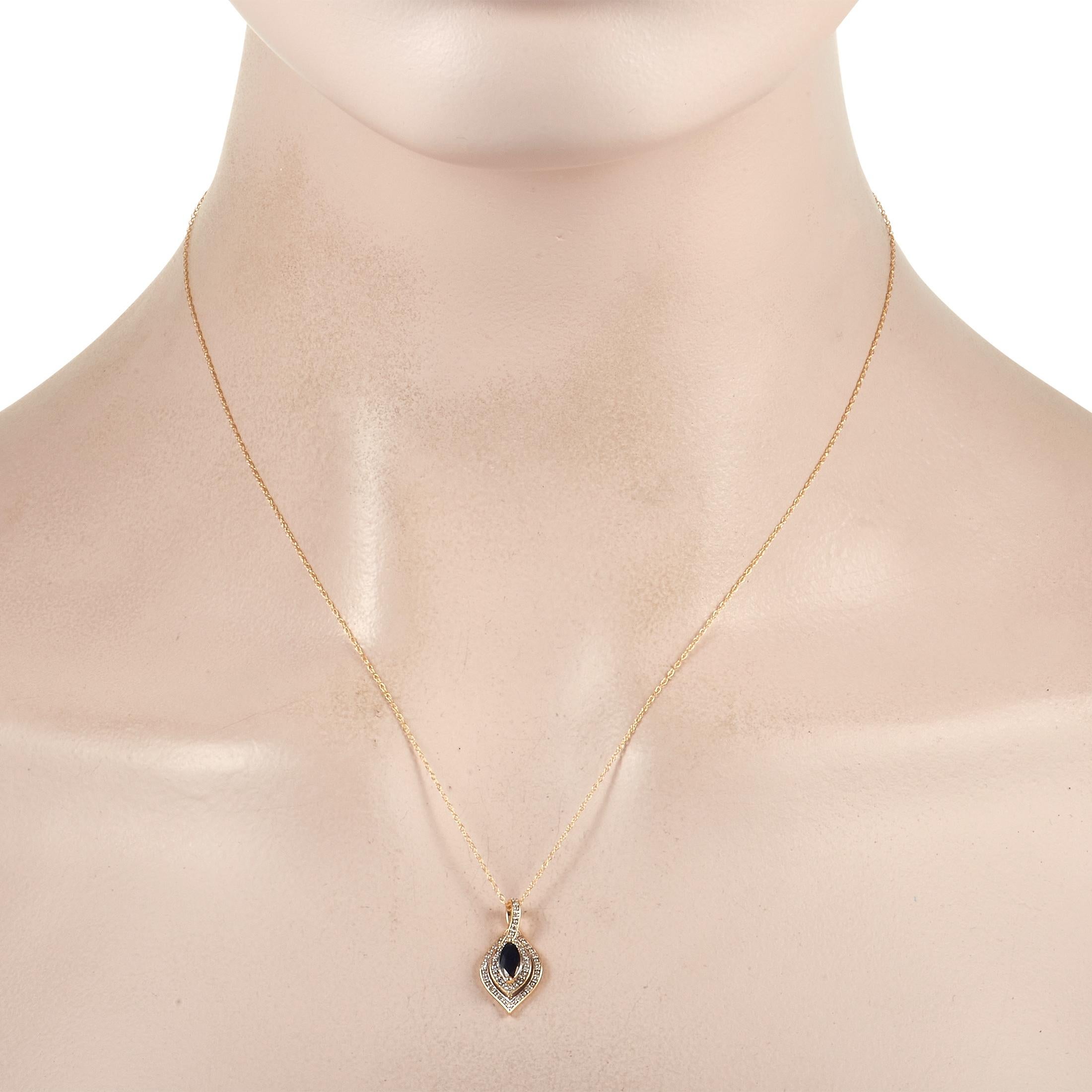This luxurious 14K Yellow Gold necklace has a timeless quality that makes it an essential addition to any collection. At the center of the dazzling pendant, you’ll find a sapphire gemstone surrounded by diamond accents with a total weight of 0.08