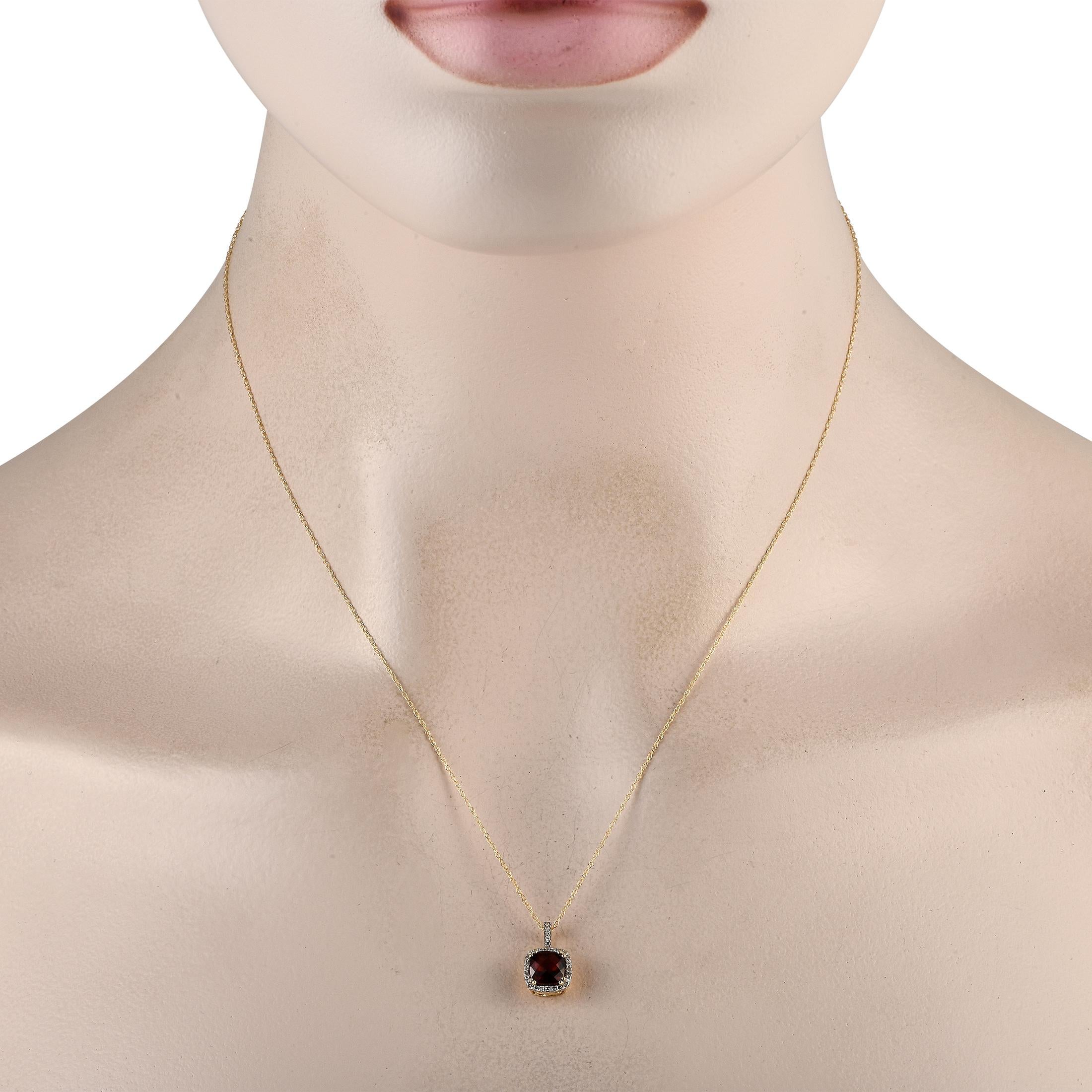 A breathtaking Garnet gemstone is surrounded by a halo of Diamonds totaling 0.09 carats on this exquisite, timeless necklace. This piece is crafted from 14K Yellow Gold and includes a pendant measuring 0.50 long by 0.25 wide suspended from an 18
