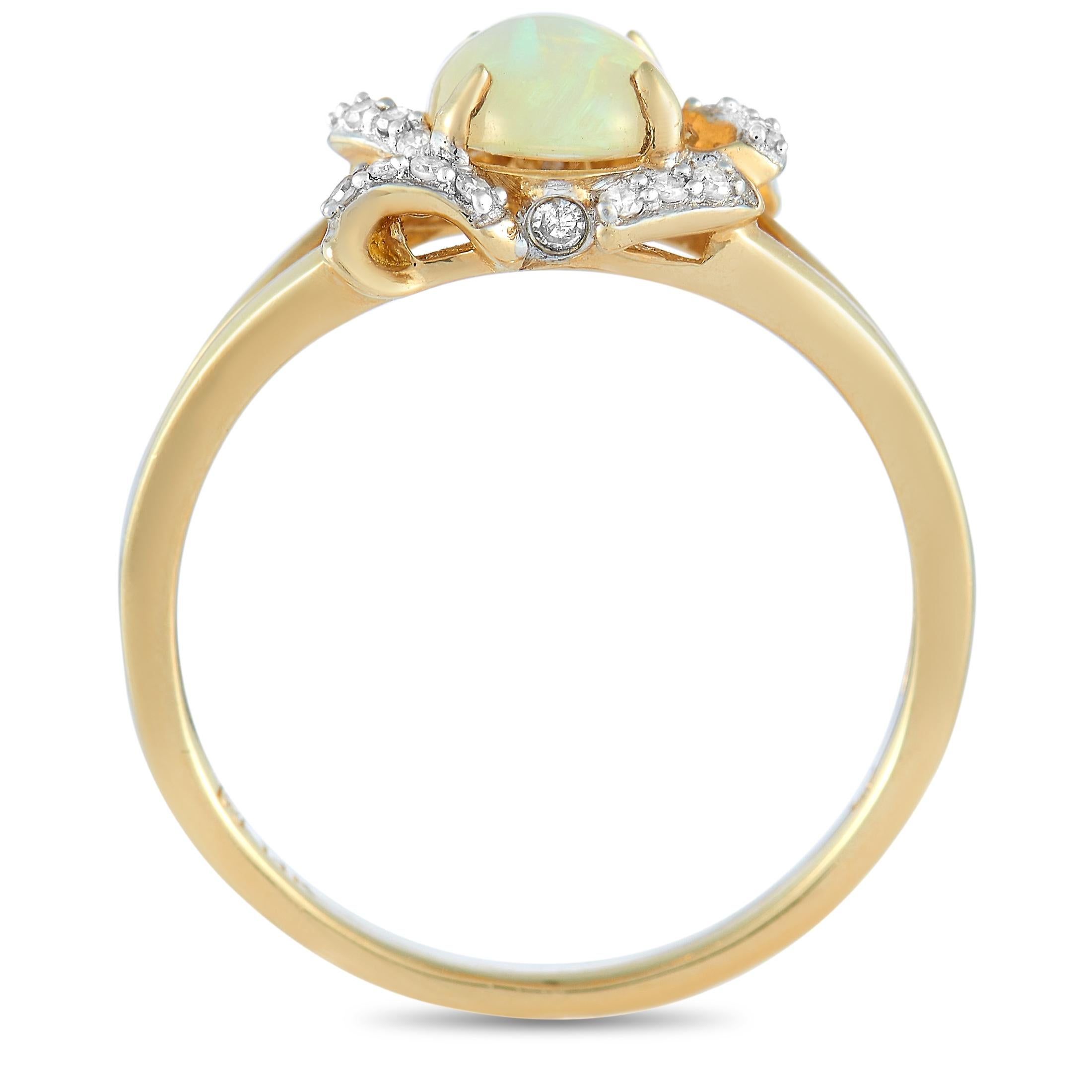 This LB Exclusive ring is crafted from 14K yellow gold and weighs 2.6 grams, boasting band thickness of 2 mm and top height of 5 mm, while top dimensions measure 11 by 8 mm. The ring is set with a 0.85 ct opal and a total of 0.10 carats of