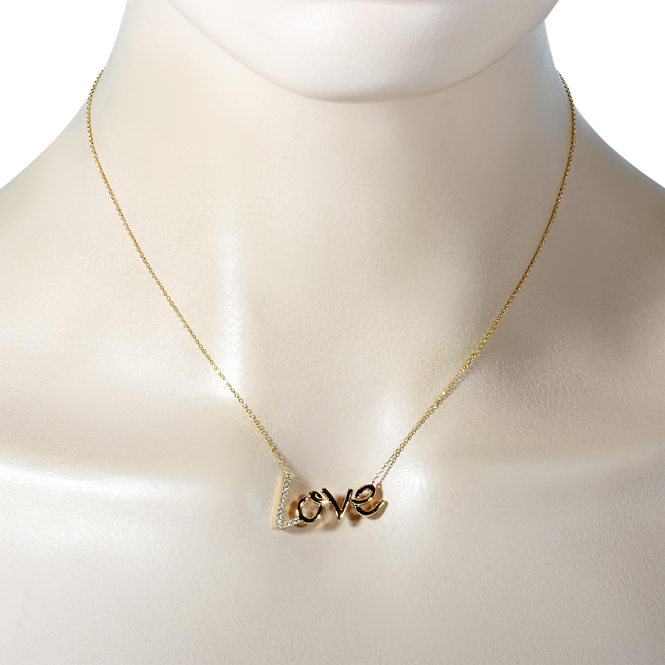 This LB Exclusive necklace is made of 14K yellow gold and embellished with diamonds that amount to 0.10 carats. The necklace weighs 3.1 grams and boasts a 16” chain and a “love” pendant that measures 1” in length and 0.50” in width.
 
 Offered in