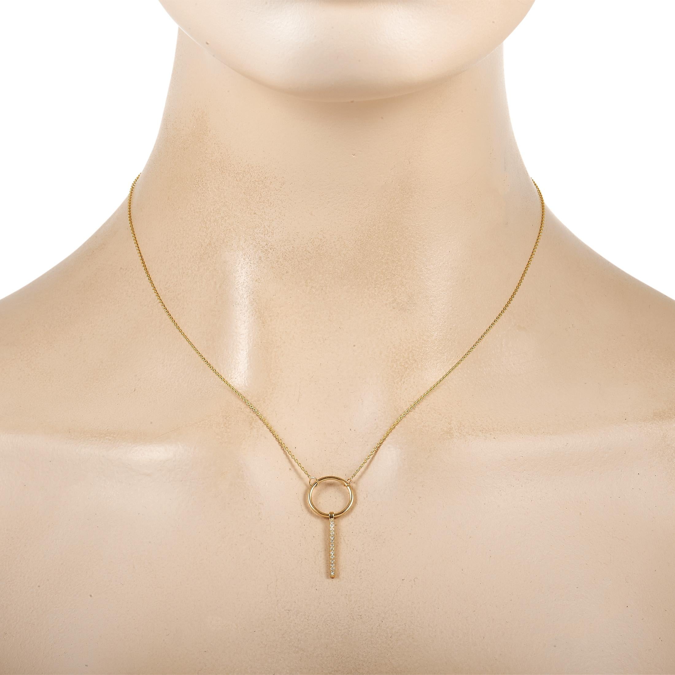 A dramatic design makes this luxury necklace a truly special addition to any jewelry collection. Crafted from 14K yellow gold, this piece features a bold pendant measuring 1.25” long and 0.5” wide suspended from a 16.5” chain. A series of diamonds