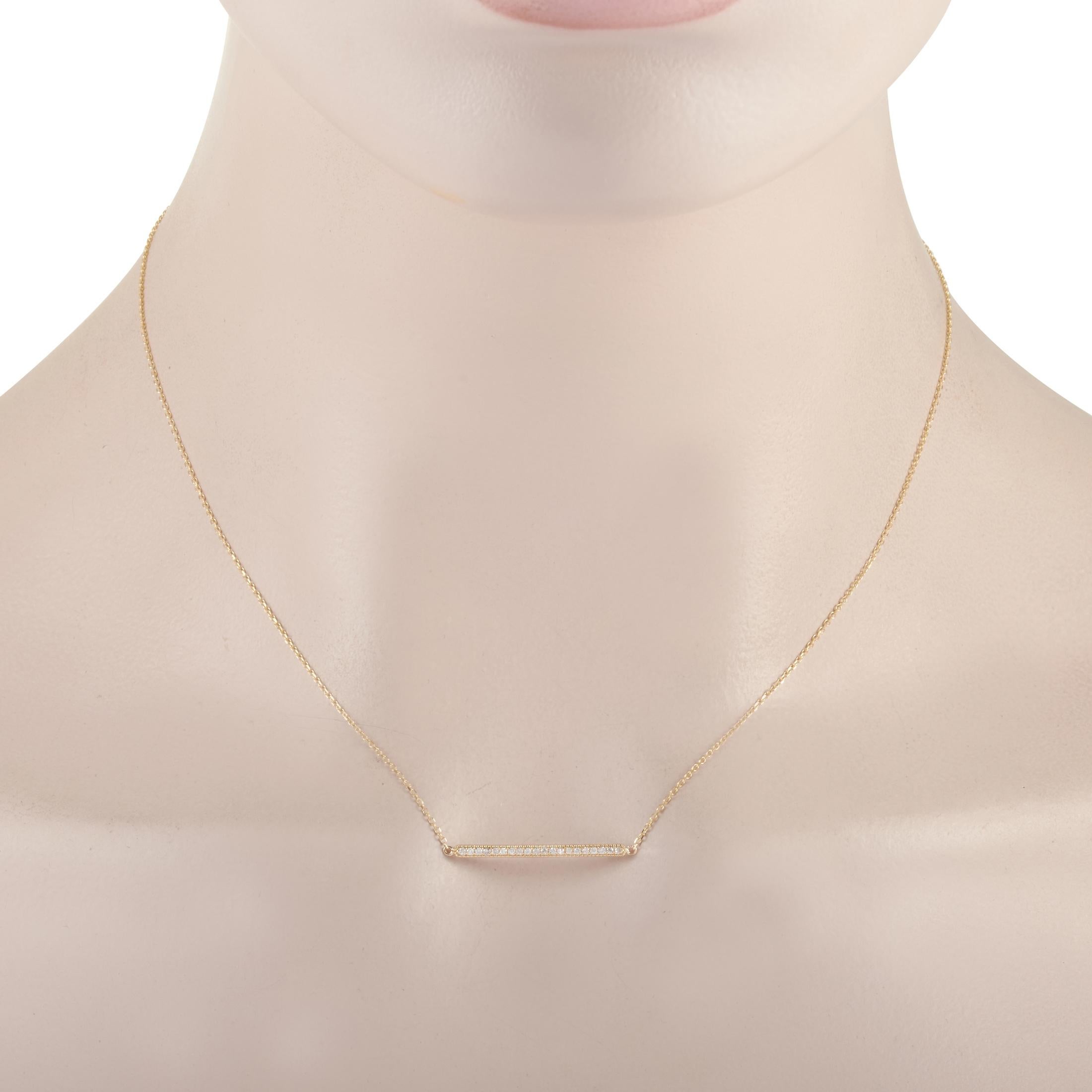 This LB Exclusive necklace is crafted from 14K yellow gold and weighs 1.7 grams. It is presented with a 15” chain and boasts a pendant that measures 0.07” in length and 1” in width. The necklace is set with diamonds that total 0.10 carats.
 
