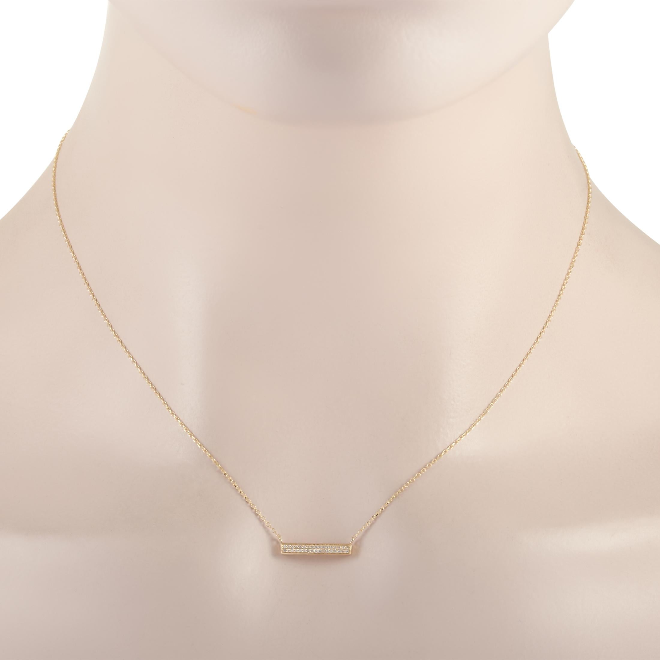This LB Exclusive necklace is made of 14K yellow gold and embellished with diamonds that amount to 0.10 carats. The necklace weighs 1.5 grams and boasts a 15” chain and a pendant that measures 0.13” in length and 0.63” in width.
 
 Offered in brand