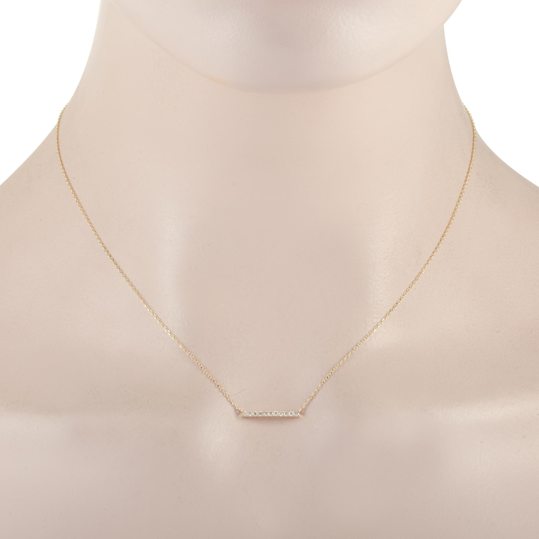 This LB Exclusive necklace is crafted from 14K yellow gold and weighs 1.6 grams. It is presented with a 15” chain and boasts a pendant that measures 0.07” in length and 0.63” in width. The necklace is set with diamonds that total 0.10