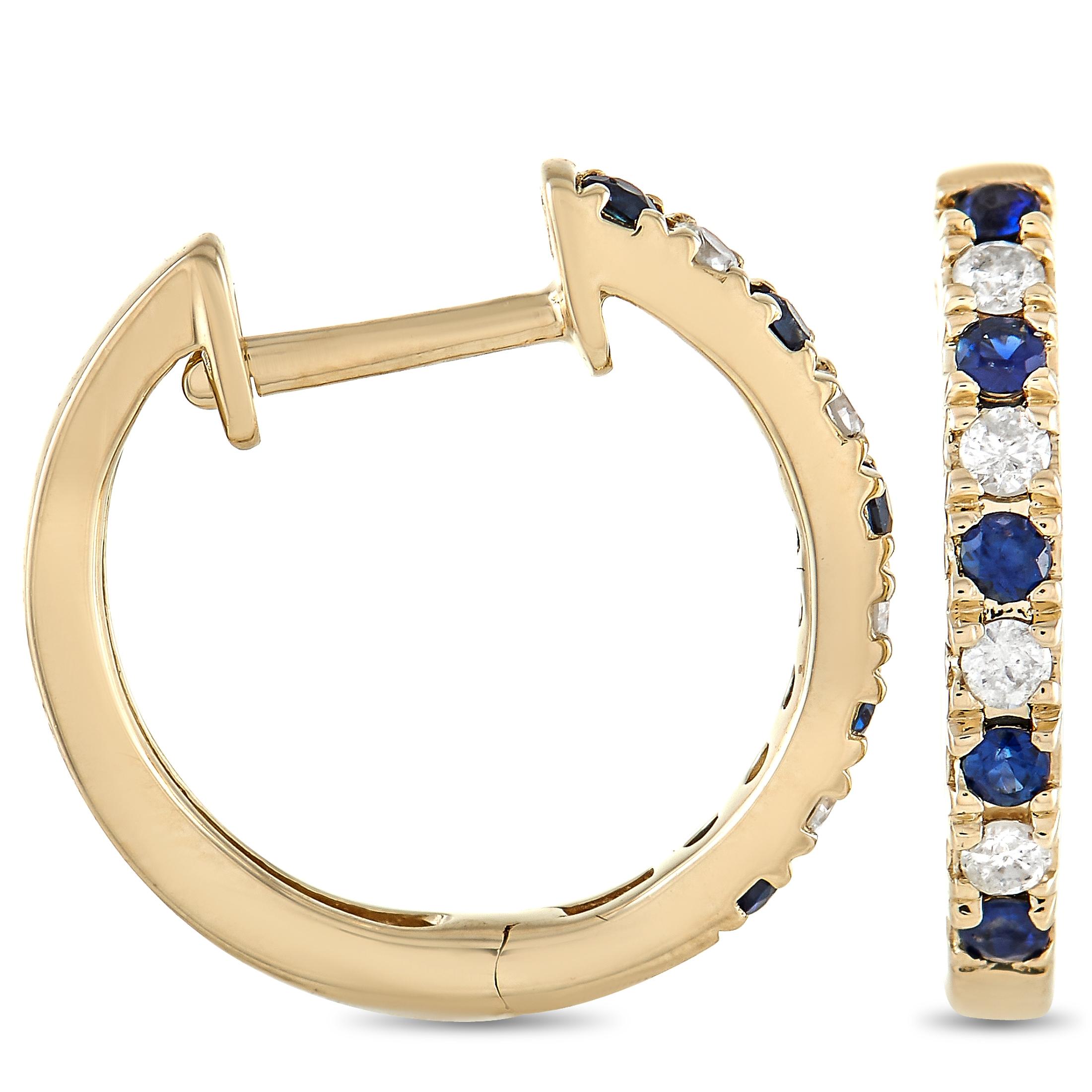 These luxurious hoop earrings are simply exquisite. Measuring .57” round, they feature an opulent 14K Yellow Gold setting. Each one also includes 0.11 carats of glittering diamonds alternating with 0.17 carats of dark blue sapphires. 
  
  This