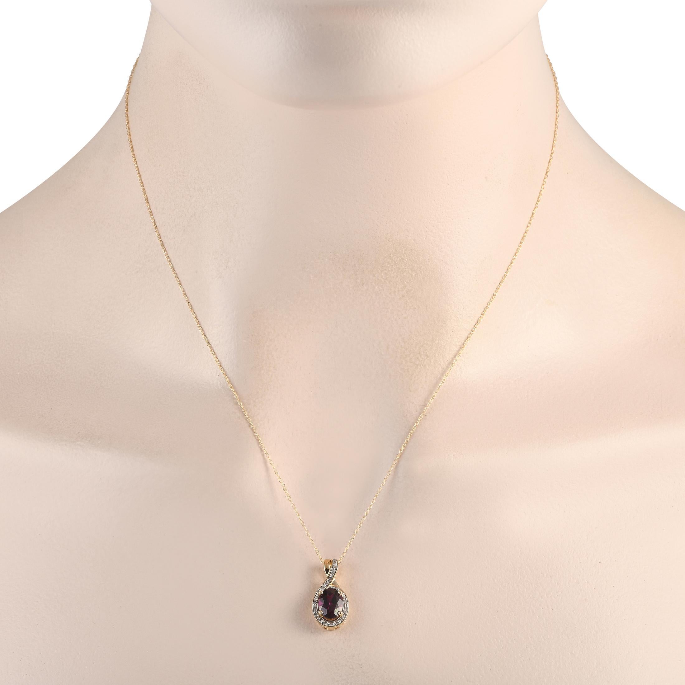 A stunning garnet gemstone surrounded by diamonds totaling 0.11 carats makes a statement on this timeless necklace. Crafted from 14K yellow gold, the pendant measures 0.75 long by 0.45 wide and is suspended from an 18 chain.This jewelry piece is