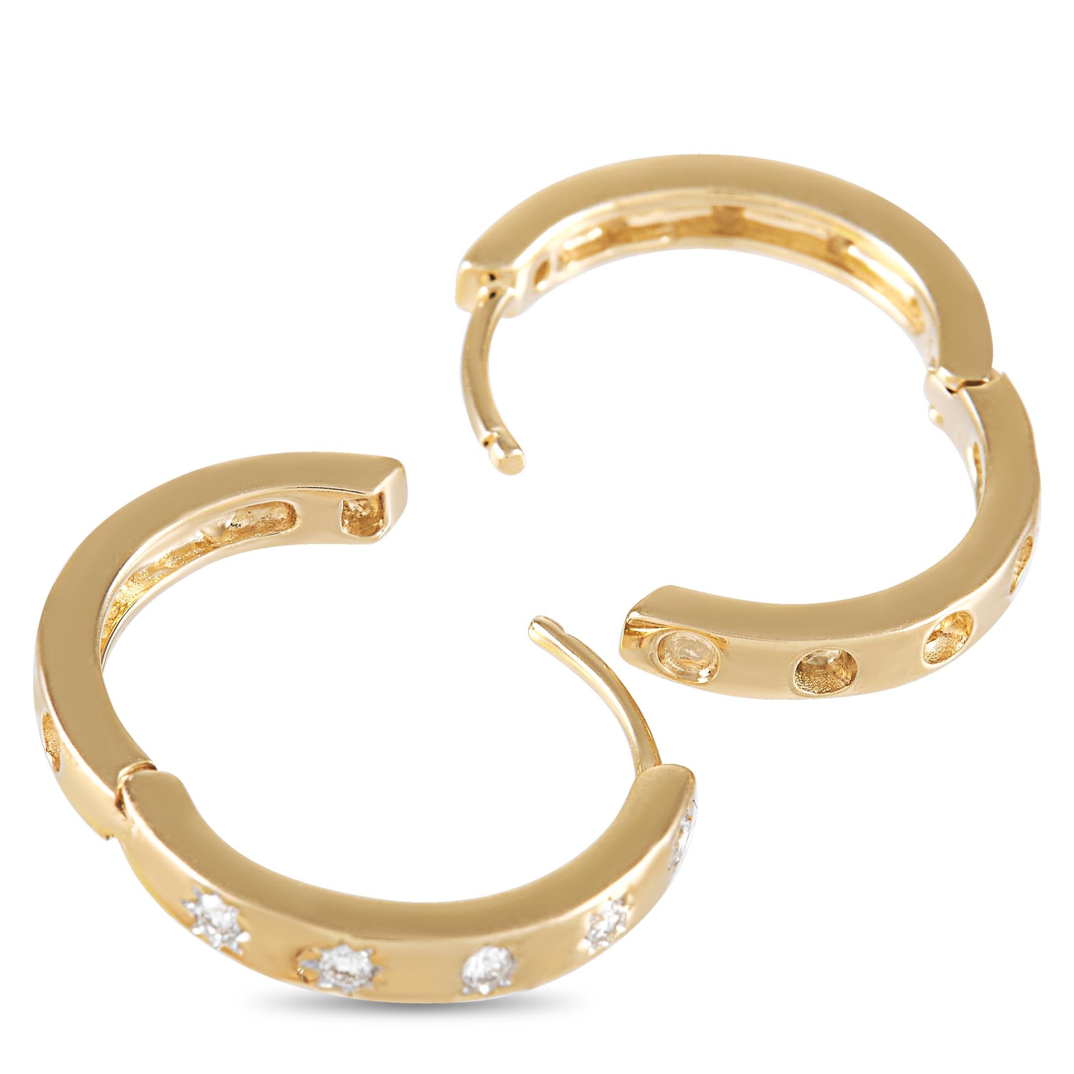 Your new wear-with-everything pair. This LB Exclusive 14K Yellow Gold 0.12ct Diamond Huggie Earrings features a pair of half-inch hoops with a hinged closure and diamond embellishment on sunray-like setting. They're in a perfect size to gently hug