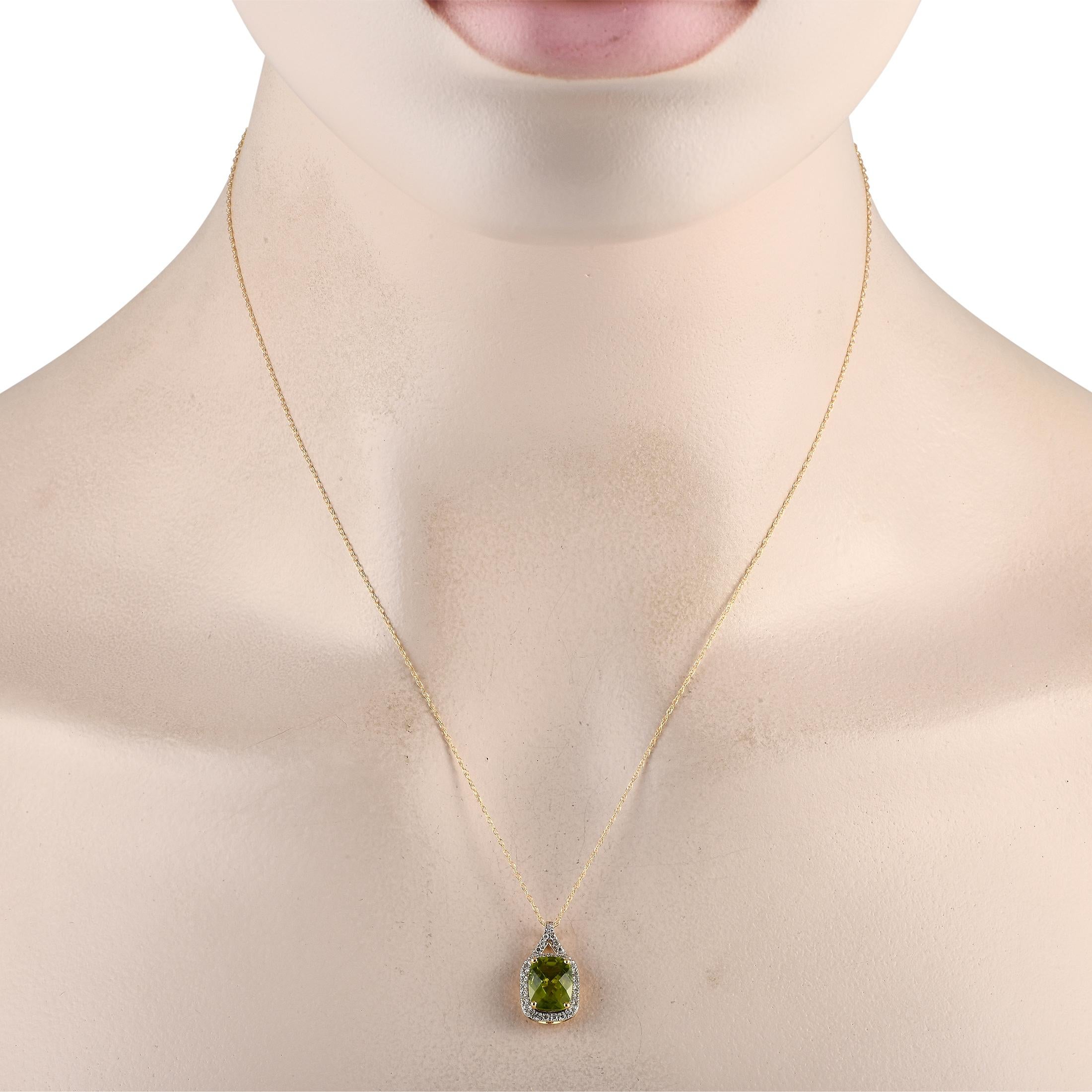 Add a pop of color to any ensemble with this simple, elegant necklace. On this pieces 14K yellow gold pendant, a stunning peridot center stone is surrounded by diamond accents totaling 0.13 carats. The pendant measures 0.75 long by 0.45 wide and is