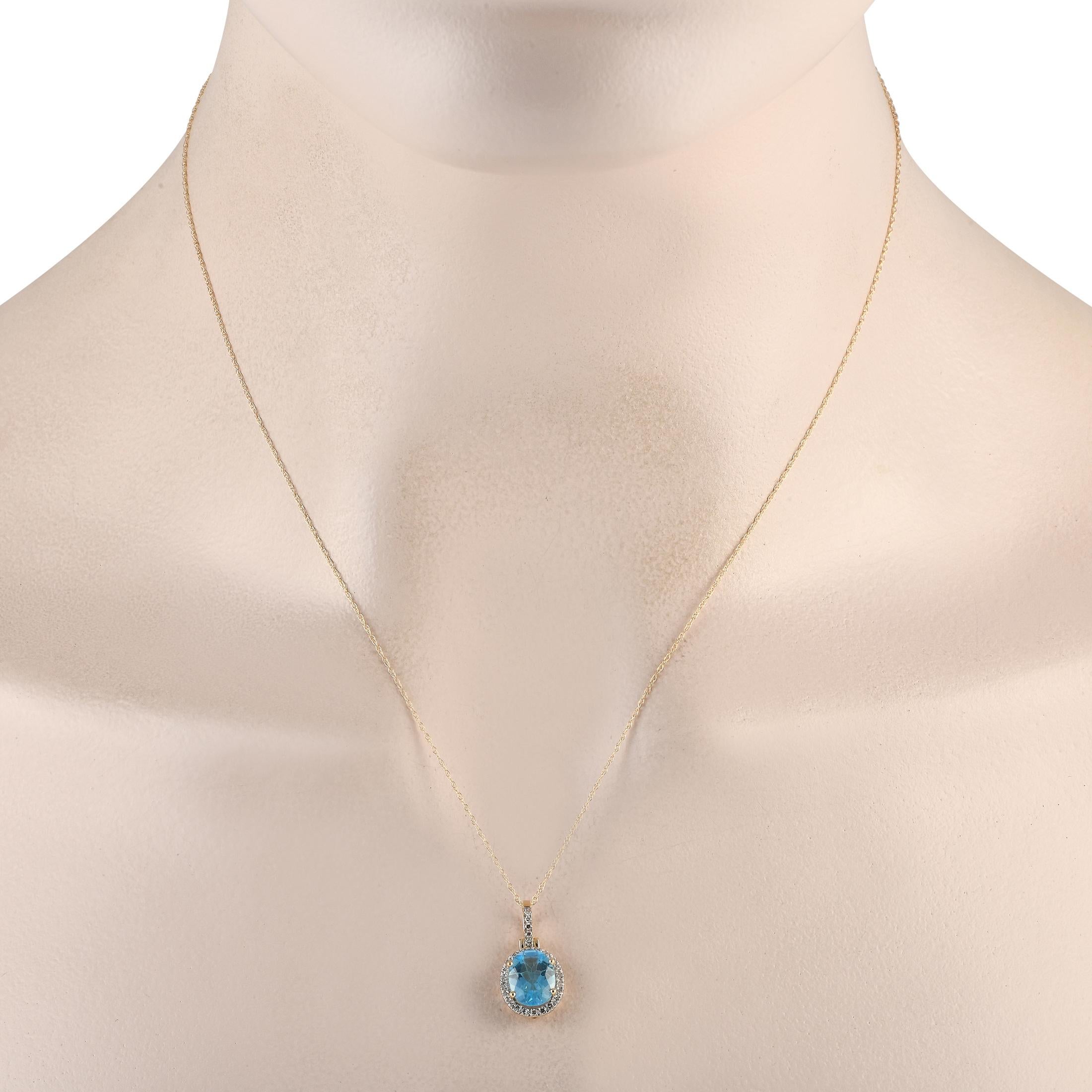 Perfect as a final touch to your cocktail or party outfit. This yellow gold necklace exudes an air of sophistication with its oval blue topaz pendant haloed by petite round diamonds. The bail is also traced with diamonds for non-stop shine. Holding