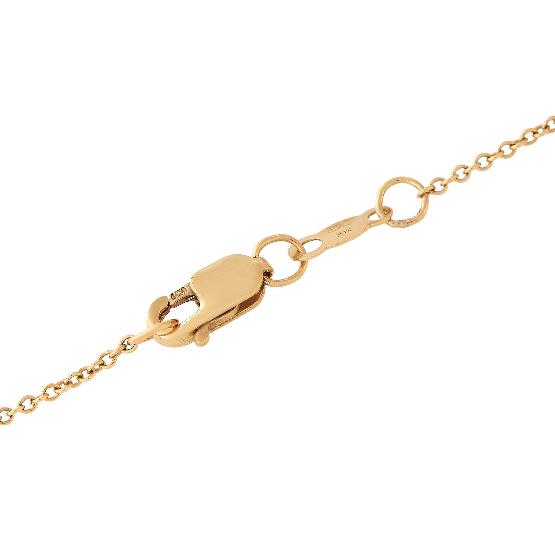 Spell it out and let the world know: you are your own queen. This necklace in 14K yellow gold has the word queen in cursive, traced with petite round diamonds. A sculpted crown embellished with diamonds is also present as a glittering accent.This