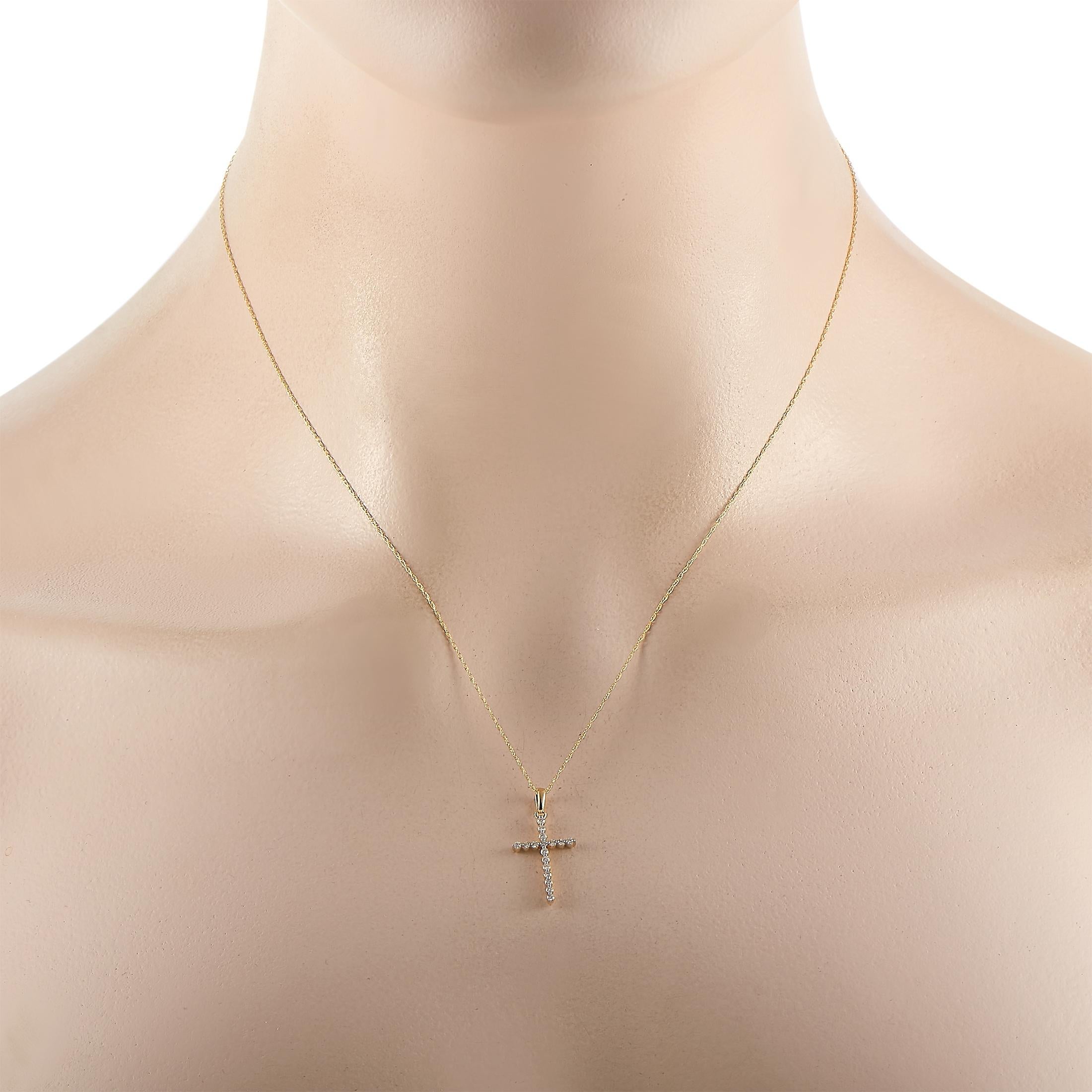 Sweet and simple, this cross pendant necklace shimmers every time it catches the light. Suspended from a 17” chain, you’ll find a cross-shaped pendant covered in entirely in round-cut diamonds totaling 0.16 carats that measures .88” long and .50”