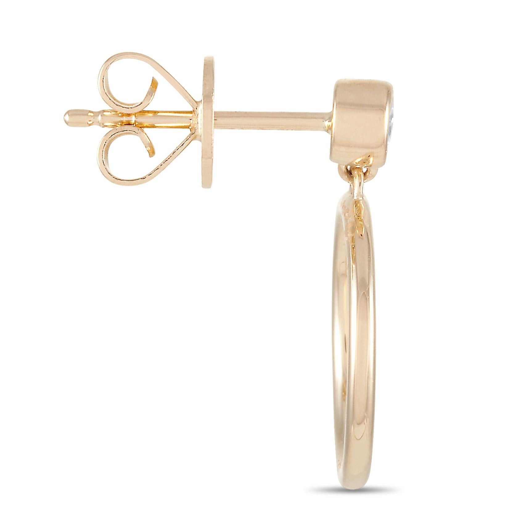 These LB Exclusive earrings are crafted from 14K yellow gold and each of the two weighs 1.1 grams. They measure 0.63” in length and 0.50” in width. The pair is set with diamonds that total 0.18 carats.
 
 The earrings are offered in brand new