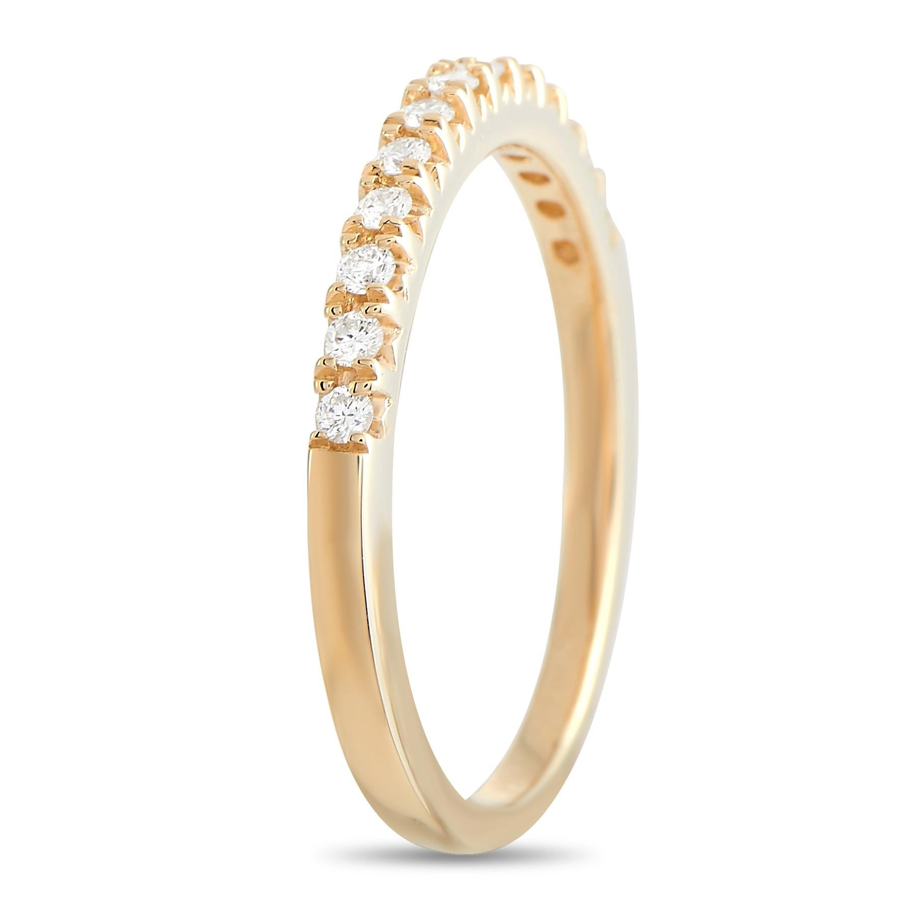 This lovely LB Exclusive 14K Yellow Gold 0.20 ct Diamond Ring is made with 14K yellow gold and set with a single row of round-cut diamonds totaling 0.20 carats on the front half of the ring. The ring has a band thickness of 2 mm and a total weight