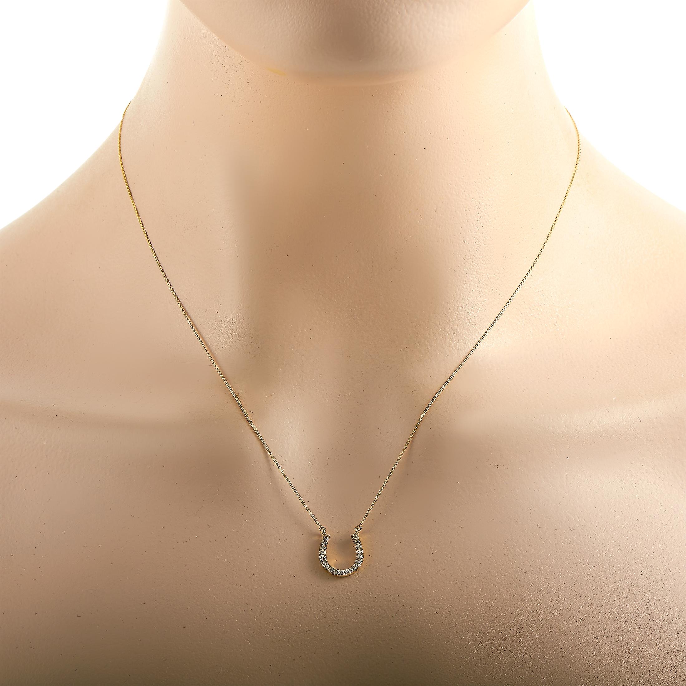 This LB Exclusive necklace is made of 14K yellow gold and embellished with diamonds that amount to 0.20 carats. The necklace weighs 2.1 grams and is presented with an 18” chain and a horseshoe pendant that measures 0.50” in length and 0.50” in